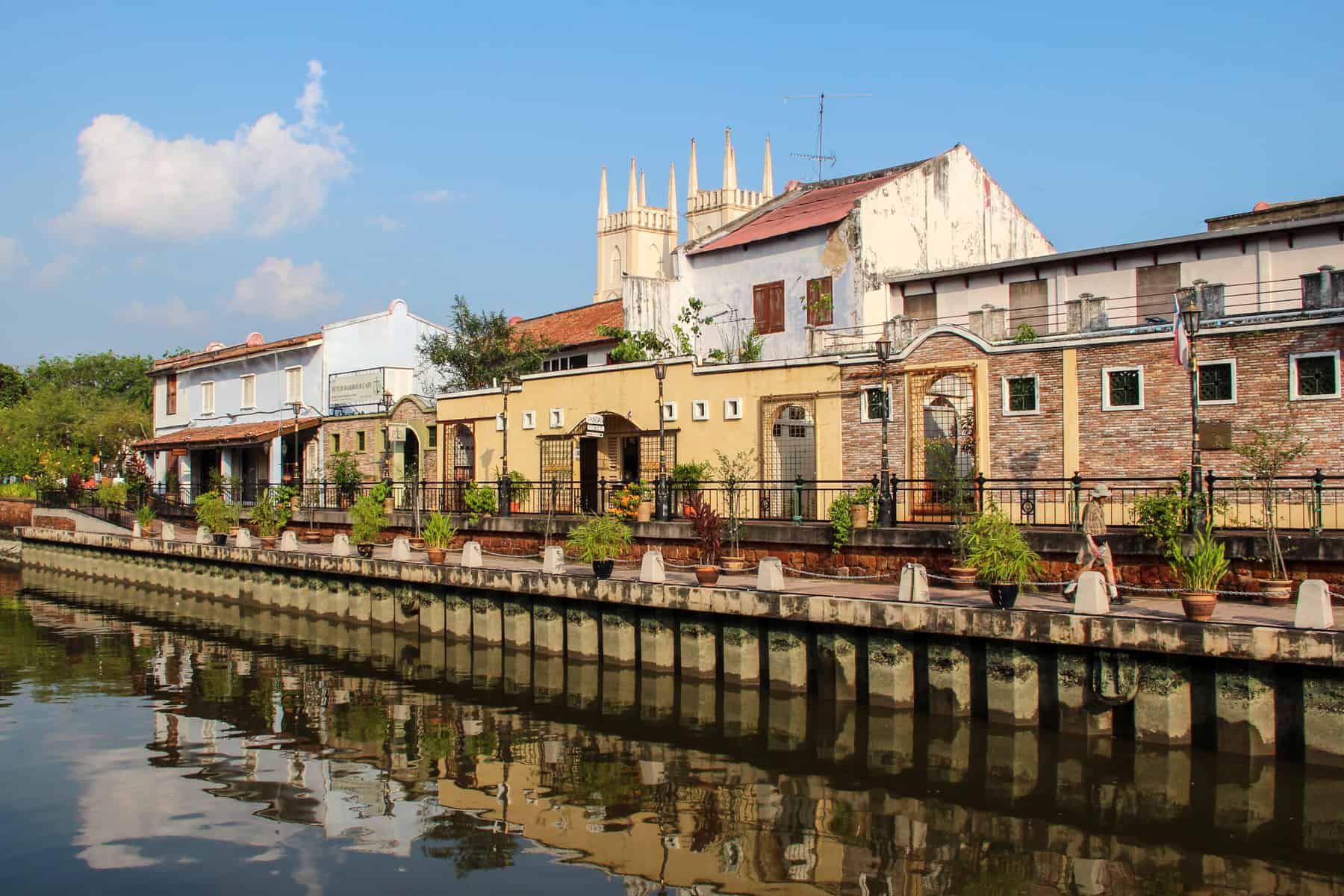 Old colonial structures line the river in Melaka, Malaysia