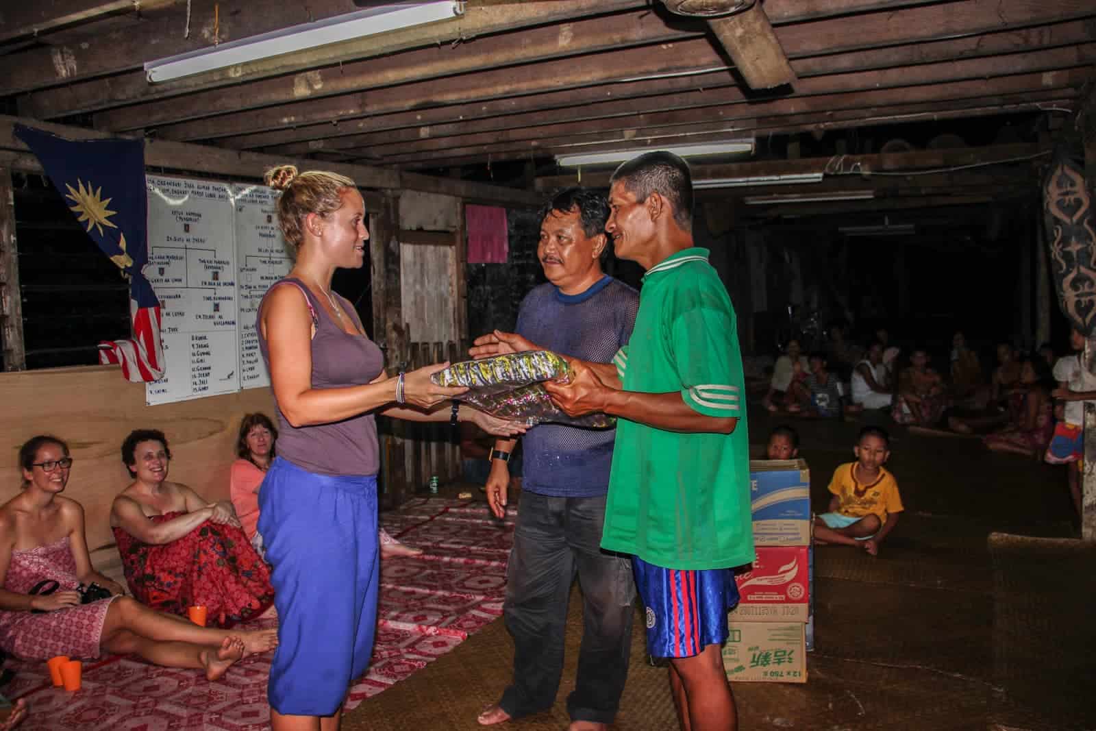 Gifting the Chief of the Iban Longhouse in Borneo