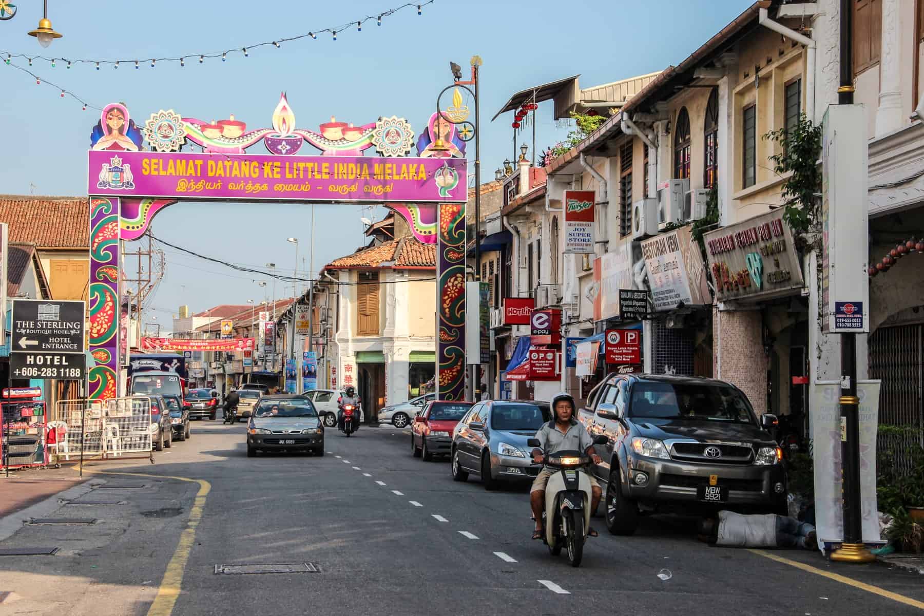 The pink street sign welcoming visitors to the designated Little India neighbourhood in Melaka, Malaysia