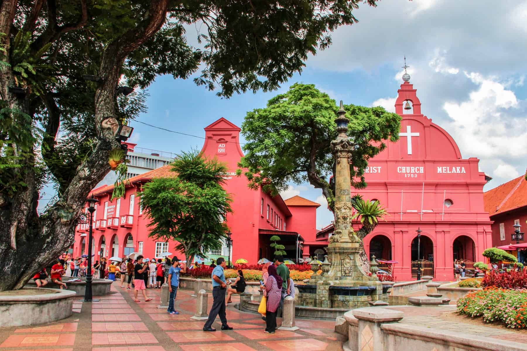 The bright salmon pink church and gallery buildings in Melaka Old Town in Malaysia