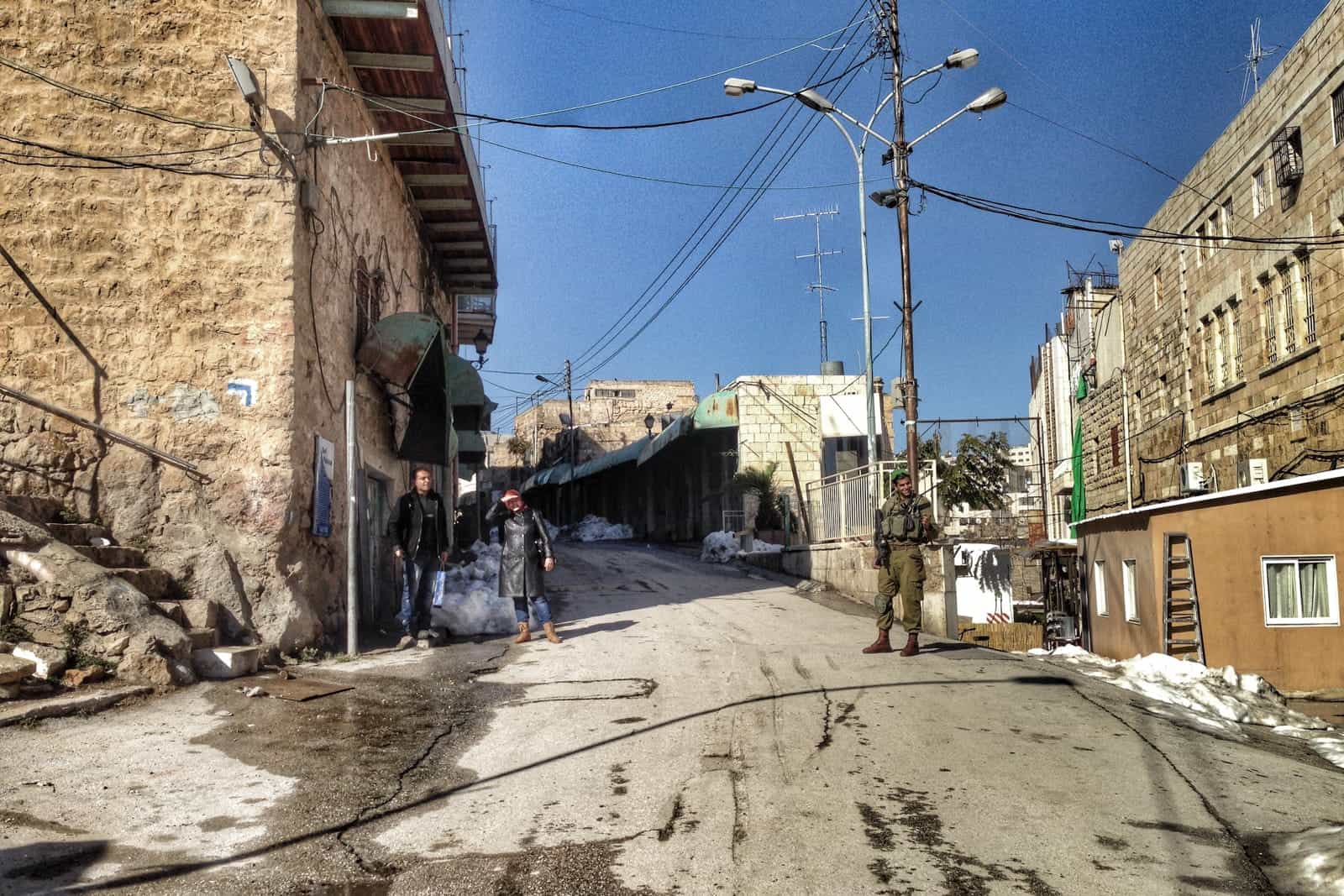 Entering the Arab side of Hebron on ‘Apartheid Street’ (Shuhada Street) on a tour