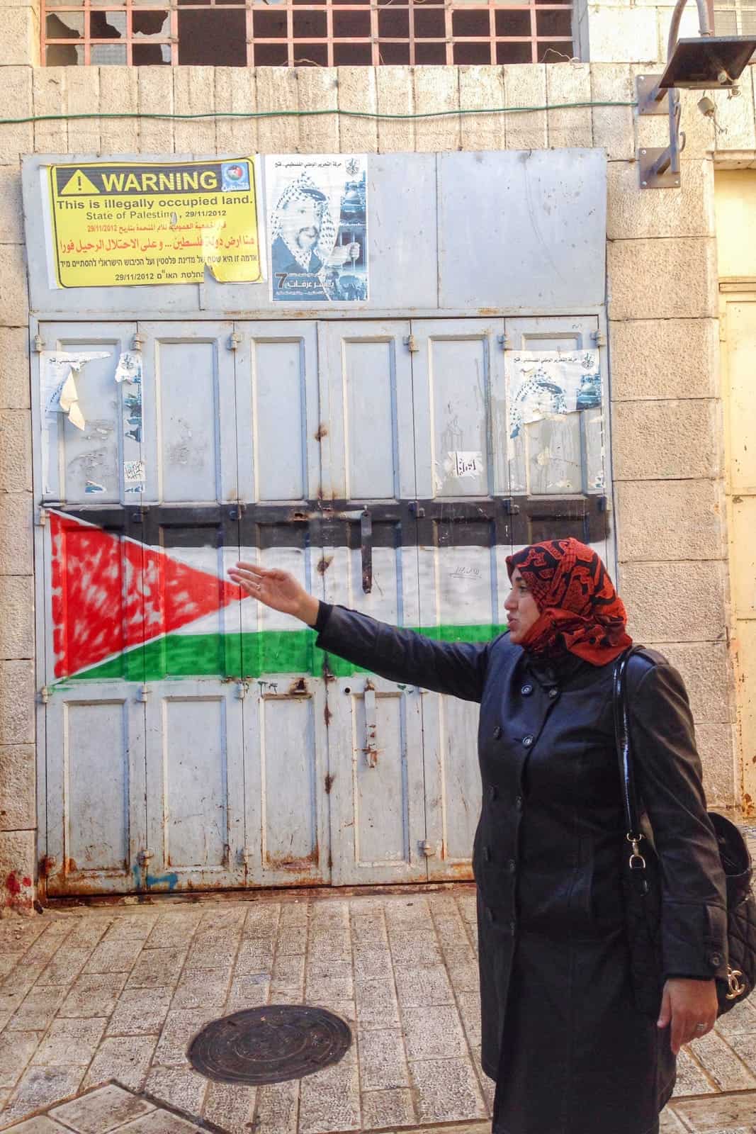 Palestinian guide on dual narrative tour of Hebron in the West Bank, Palestine