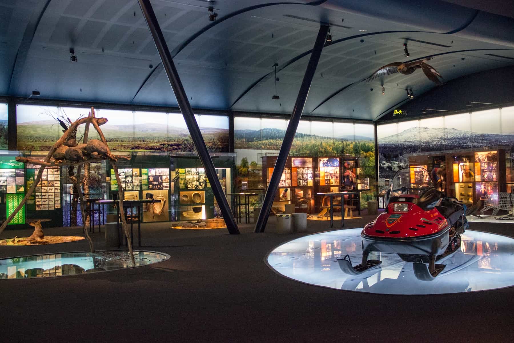 Wall-to-wall image boards and exhibits inside the Sámi Museum and Nature Centre in Inari, Finland Lapland.