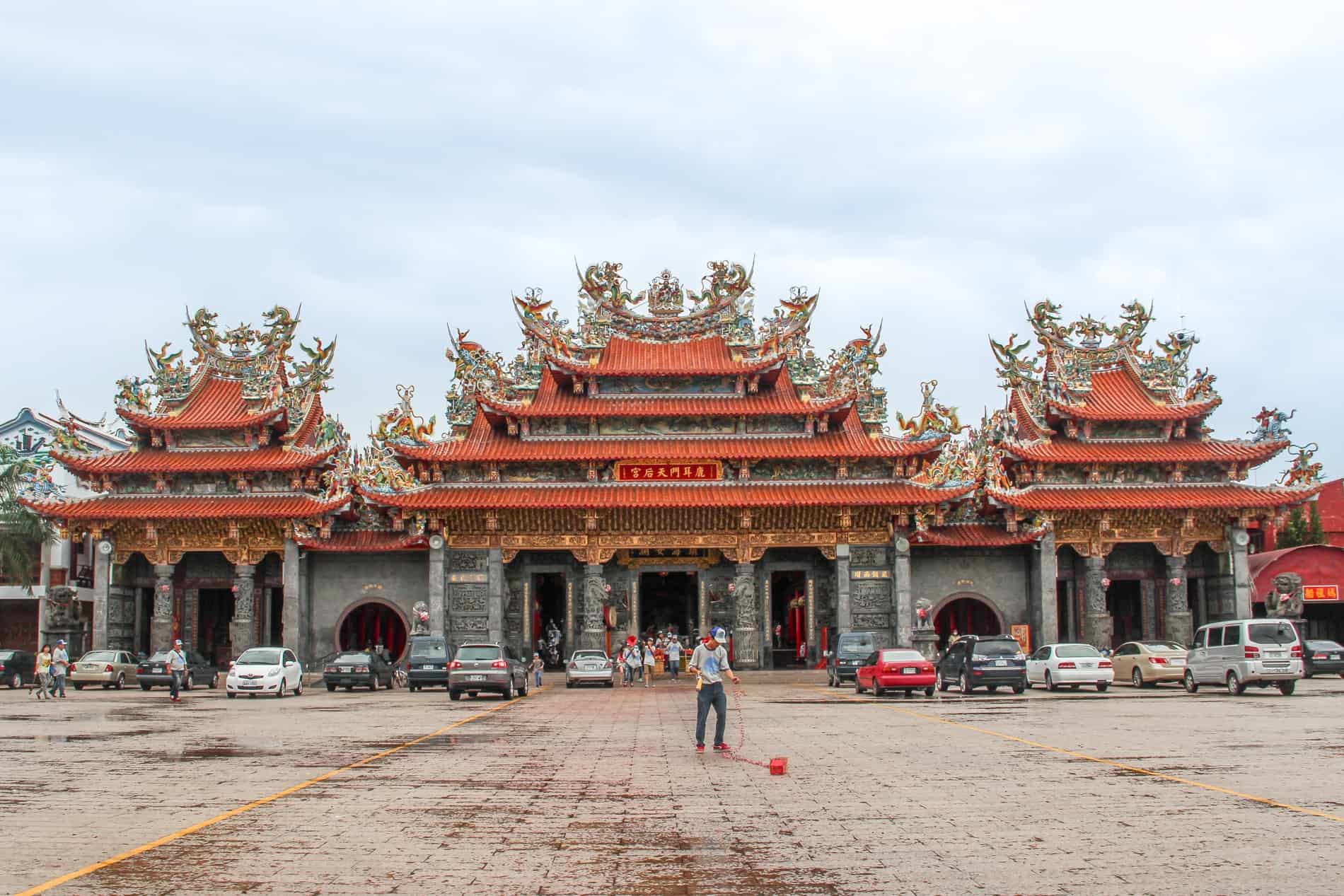 One of thesilver stone and oran ge rooftop pagoda style entrances to the Luermen Matsu Temple in Tainan. 