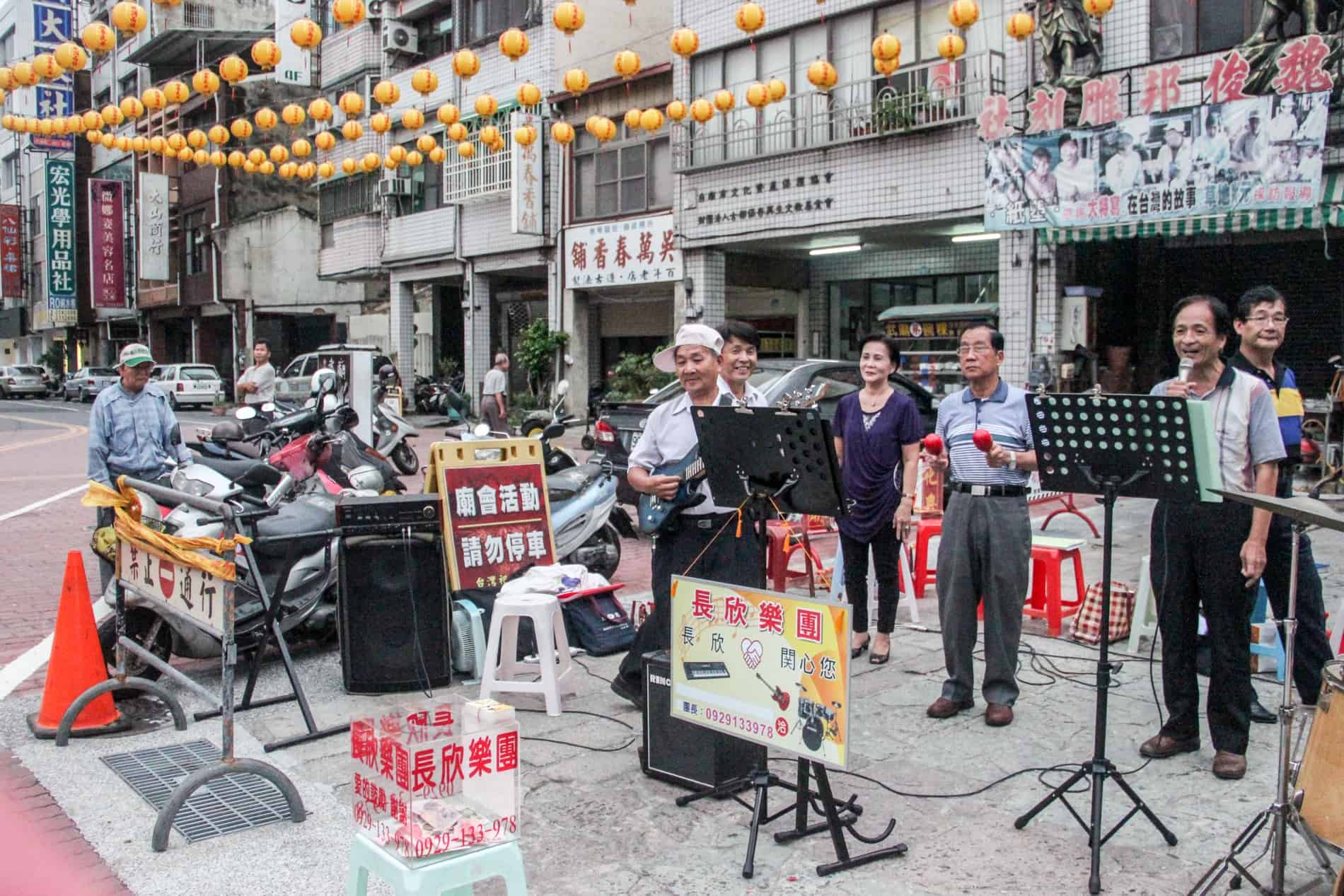 A band plays live music in a street in Tainan, Taiwan. 