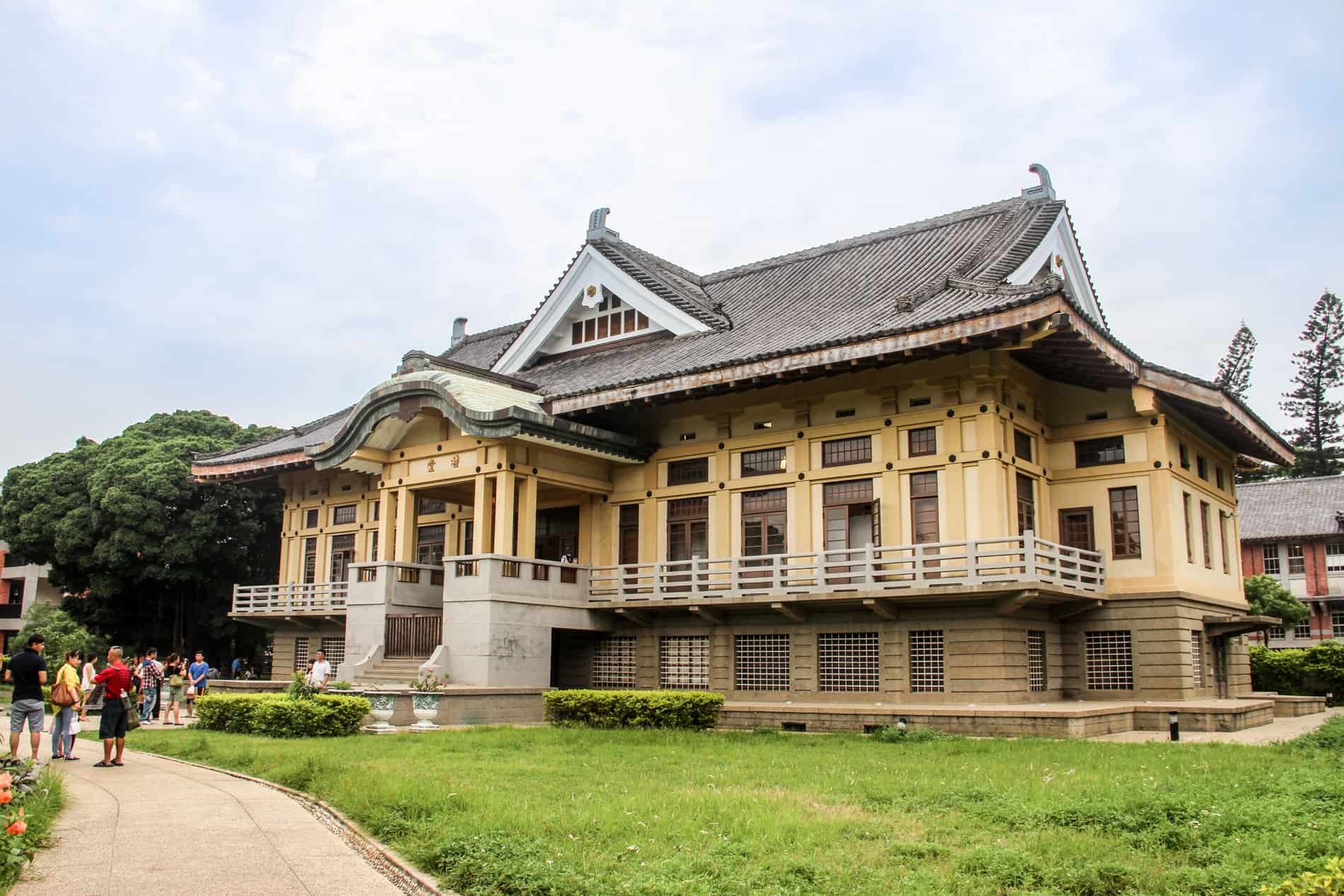 A yellow building in traditional Chinese style in Tainan - the Old Martial Arts Hall.