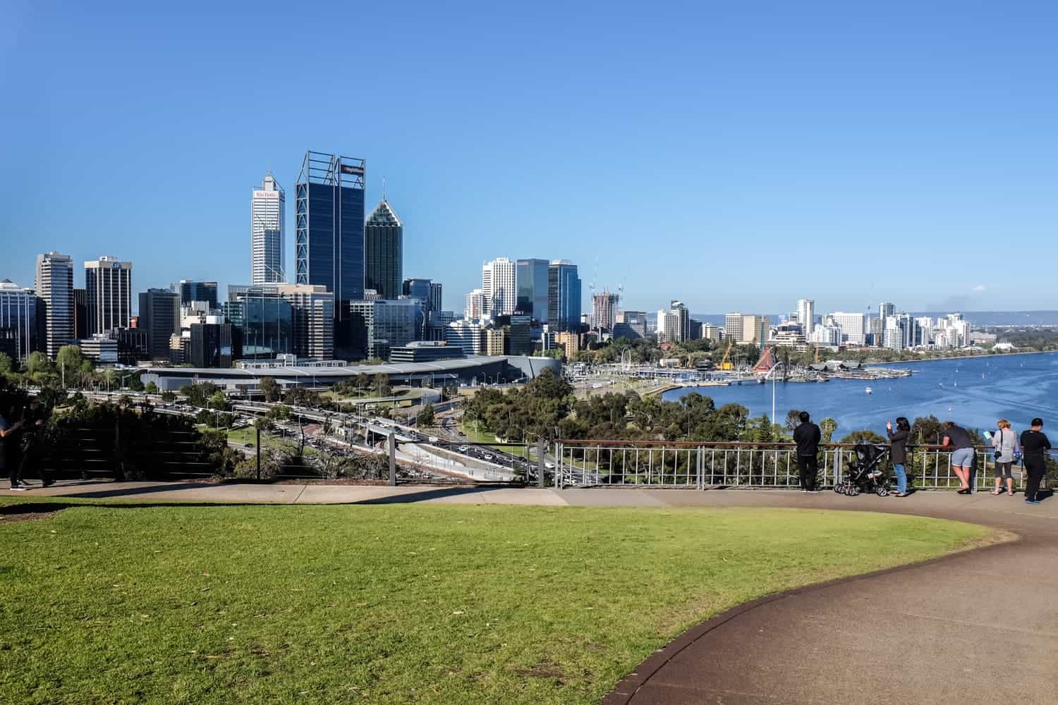 A pathway around green grass in the Kings Park and Botanic Garden in Perth - one of the world’s largest inner-city parks 