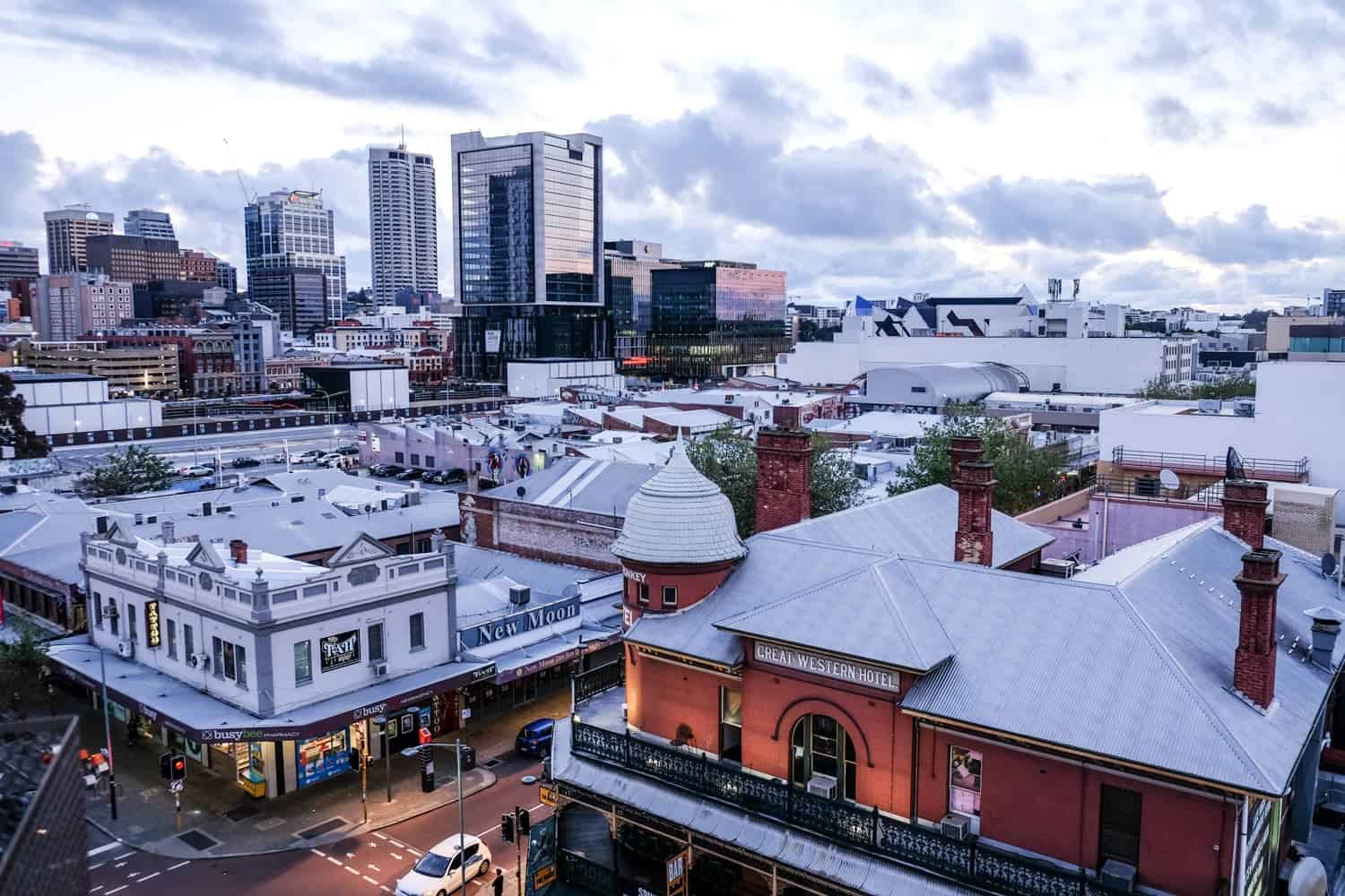 An elevated view over the white rooftops of the more modern structures of Northbridge neighbourhood in Perth, Australia