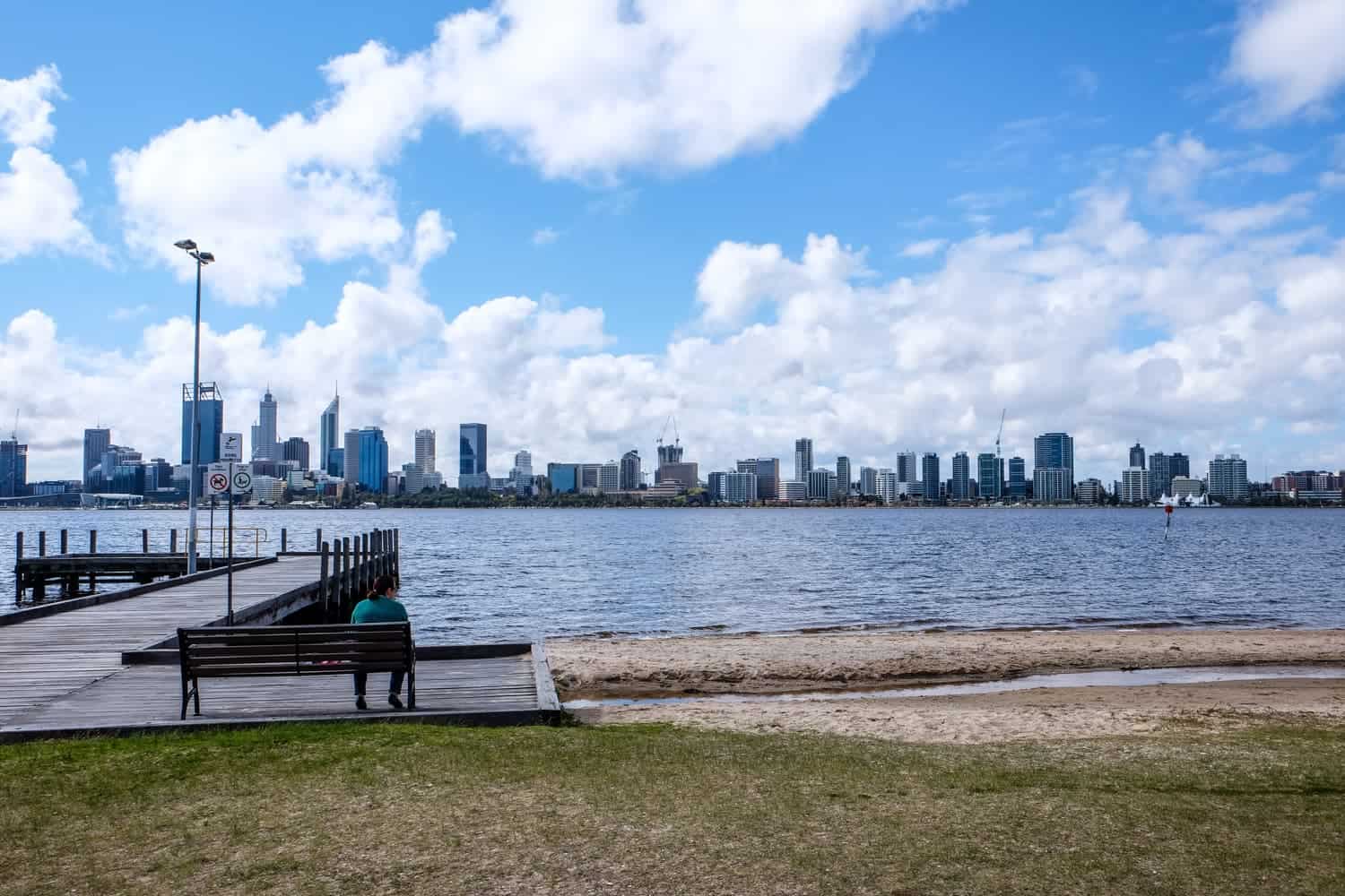 Coastline view across the river in Perth to the high rise buildings of The Perth Central Business District (CBD)