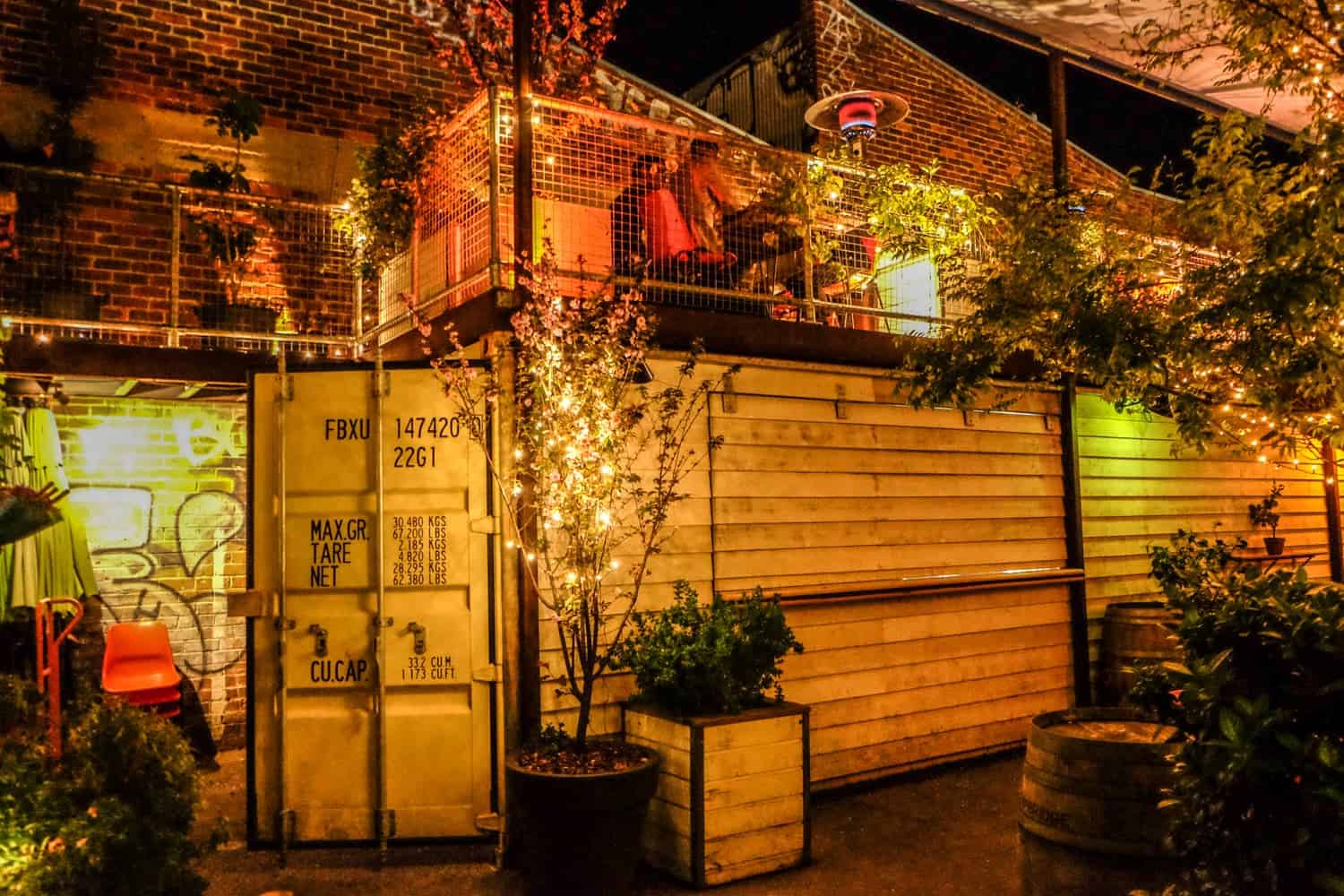 Wooden structures with steel doors and elevated terraces in a bar in Perth, Australia