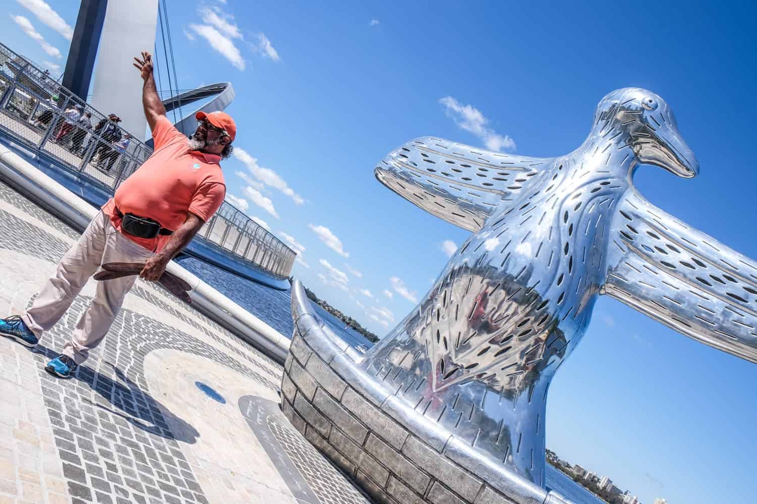 An aboriginal man in from the the large silver bird structure in Perth, Australia which is there to remember the owners of the land