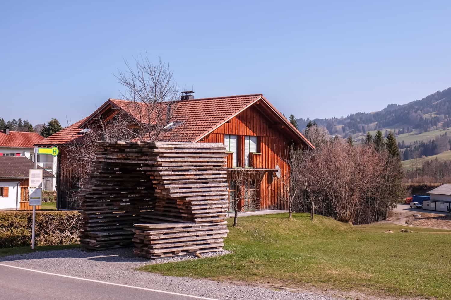 Stacked wood is one of the special design bus stops in Krumbach, Vorarlberg, Austria