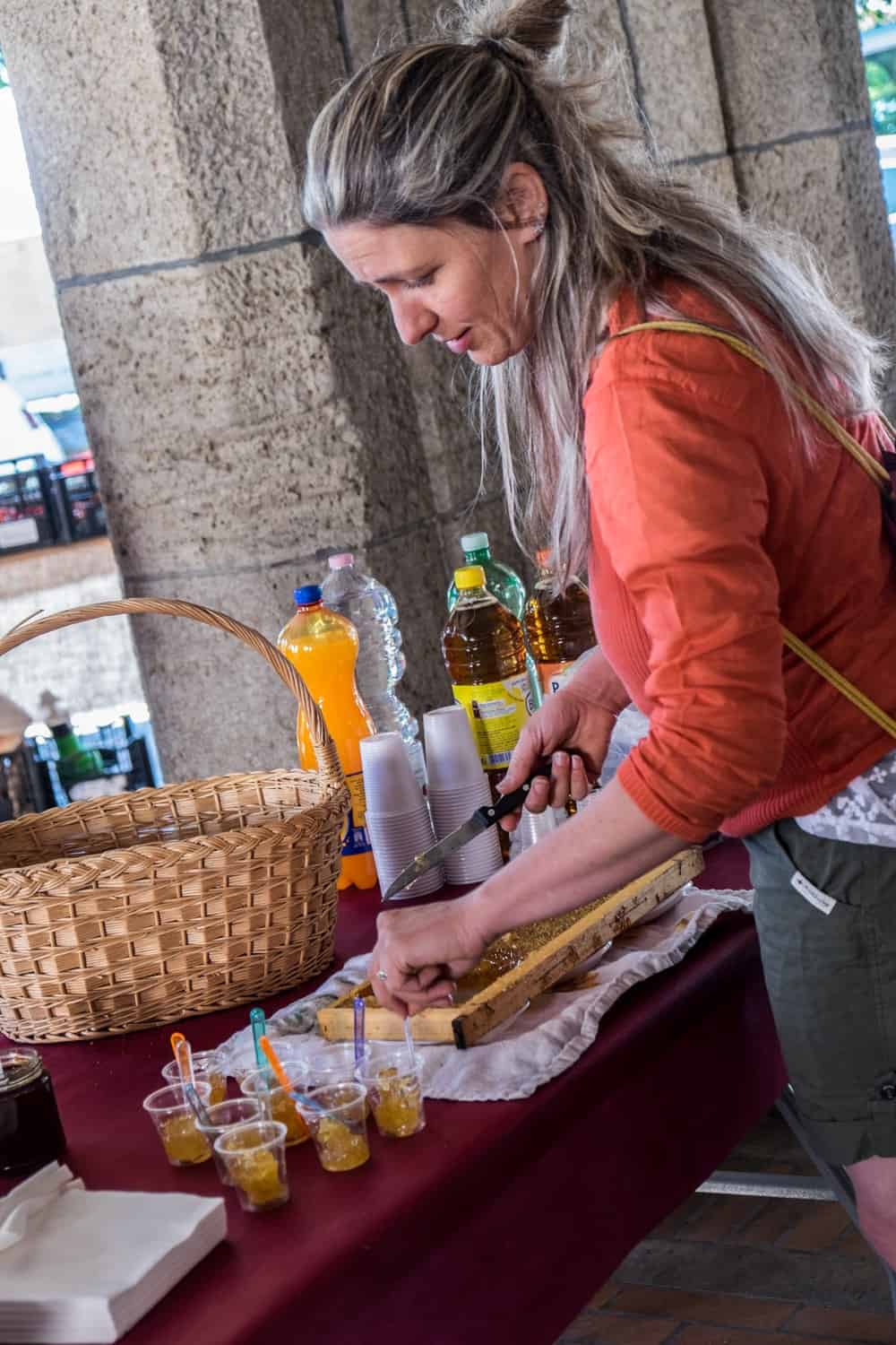 Honey maker at the Saturday food market in San Marino