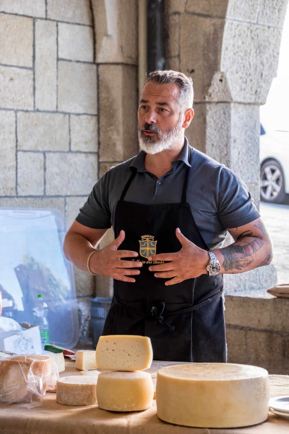 Cheese maker at the Saturday food market in San Marino