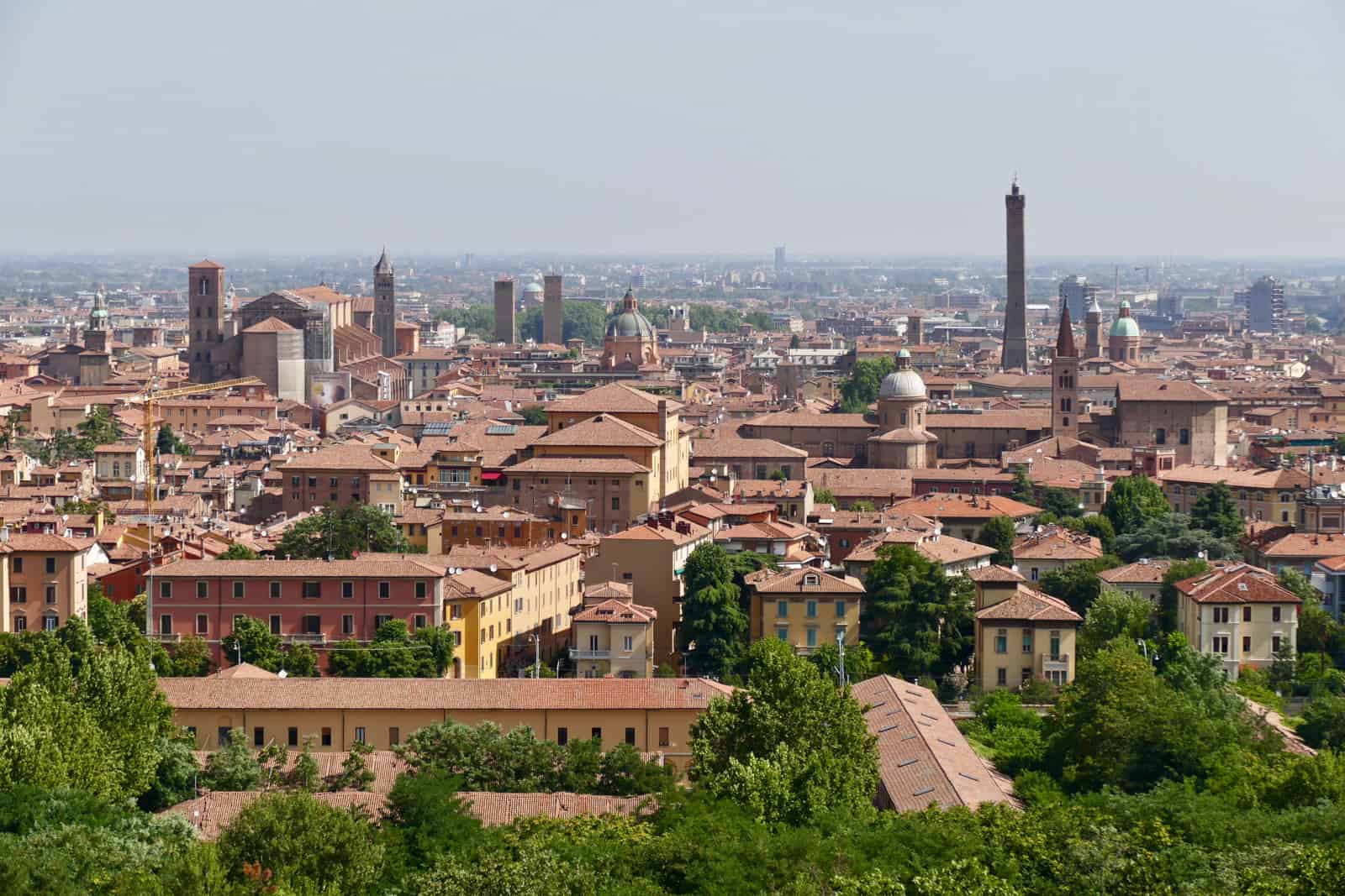 View of Bologna's orange stones structures and six stone towers, from San Michele In Bosco, Italy