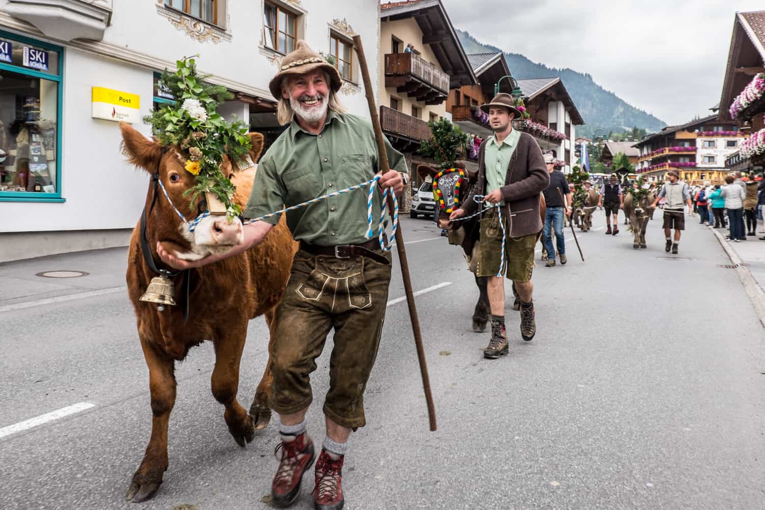 Farmers and cows at Almabtrieb in Lermoos village in Zugspitz Arena, Tirol, Austria