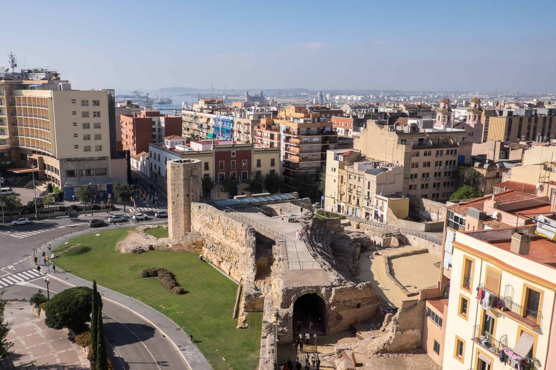 Ariel View of the ruins of the Roman Circus in Tarragona – old stone archtiecture surrounded by the modern buildings of today's city