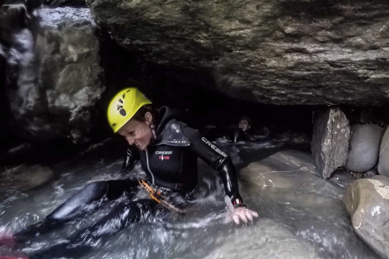 Cave swimming when canyoning in Vorarlberg Austria