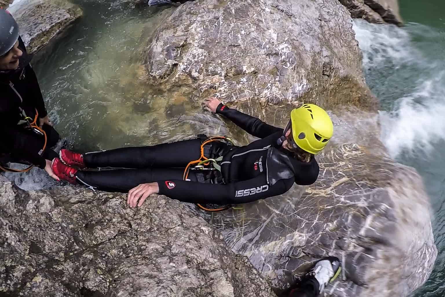 Backwards slide on the canyoning trip in Vorarlberg, Austria