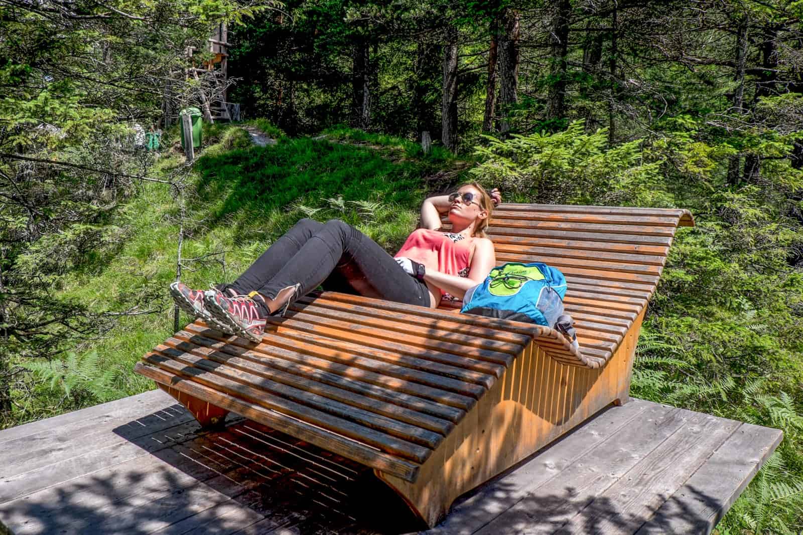 Resting on a wooden chair in the forest nature in Achensee, Tirol, Austria