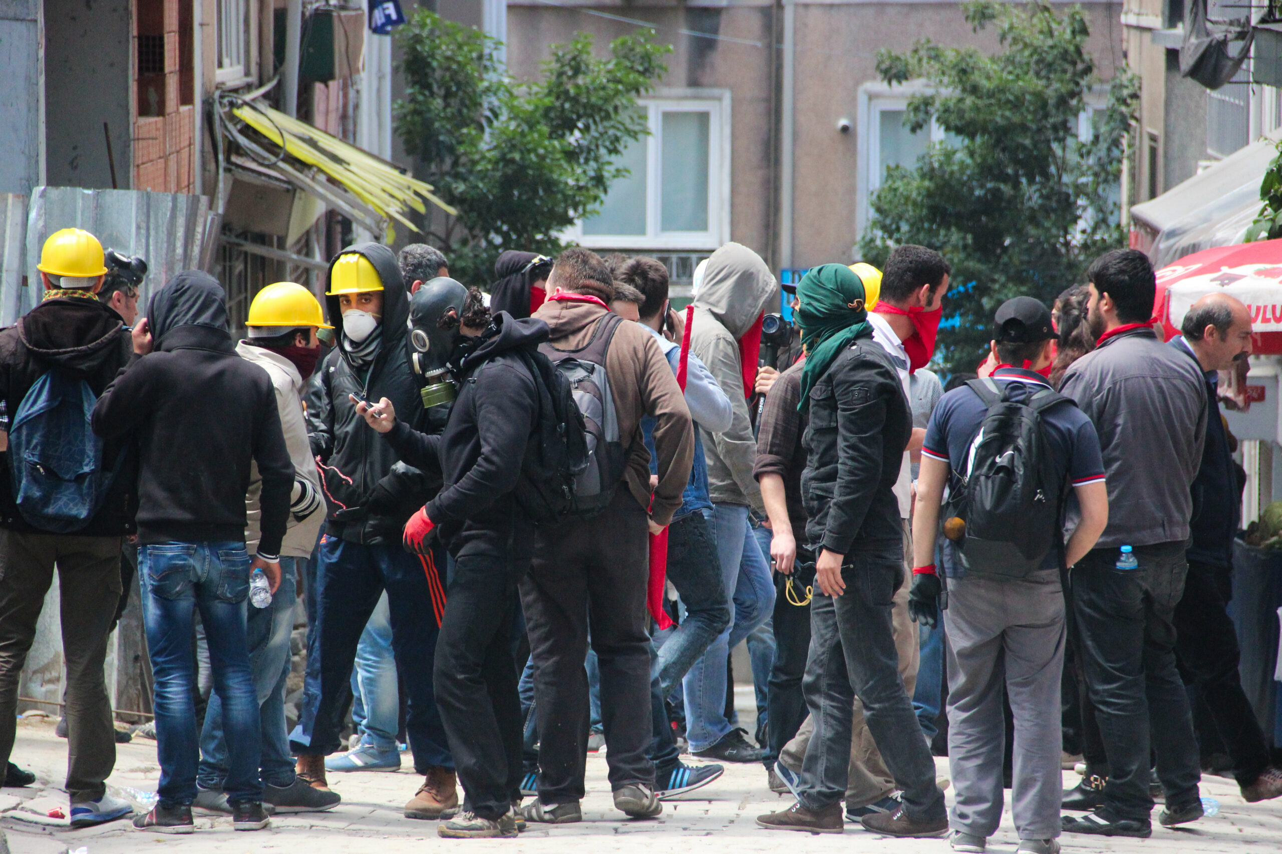 A group of protesters dressed in dark clothing and face coverings gathered together in the Taksim neighbourhood in Istanbul.