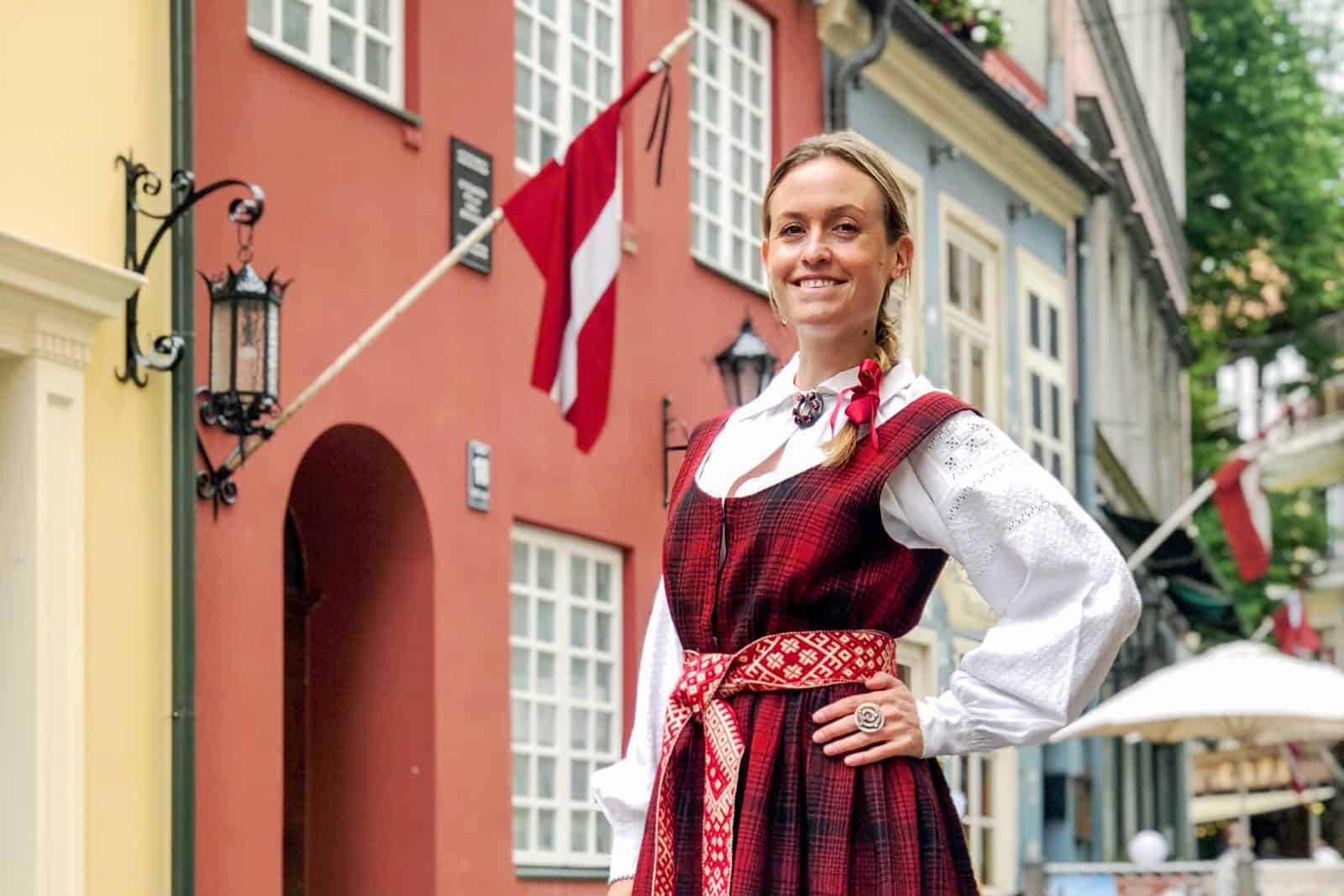 Woman wearing traditional Latvian folk costume clothing in Riga Old Town 
