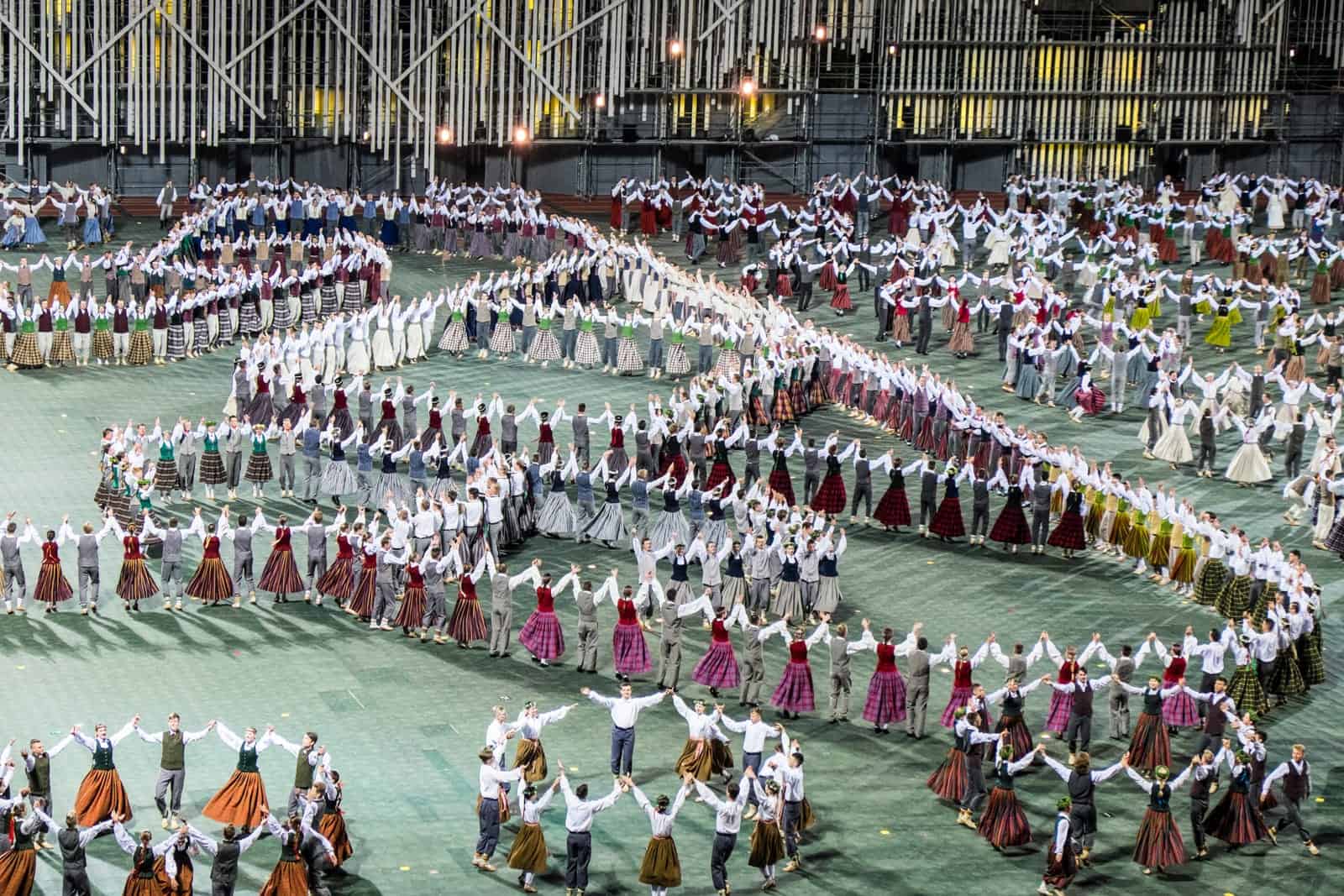 Performers at the Latvia Song Dance Festival opening stadium Great Dance show in Riga