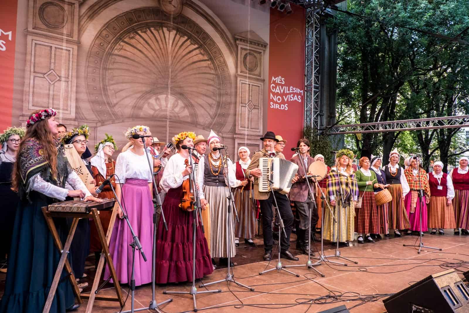 A band performs on stage in a Riga Park for the Song and Dance Celebration in Latvia