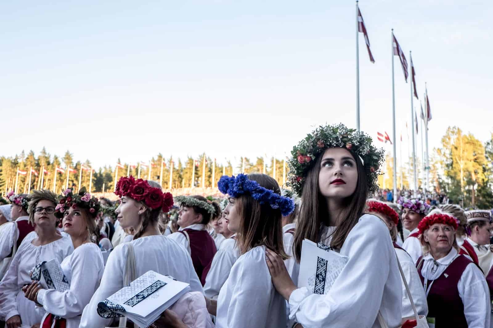 Choir singers wait to enter the stage at the Closing show of the Latvia Song and Dance Celebration