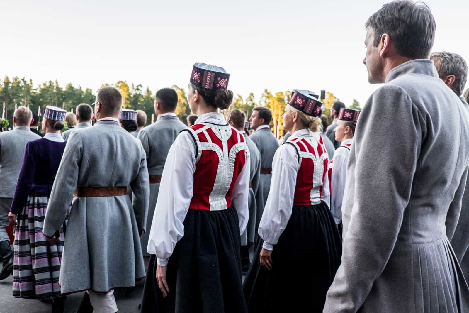 Choir singers wait to enter the stage at the Closing show of the Latvia Song and Dance Celebration