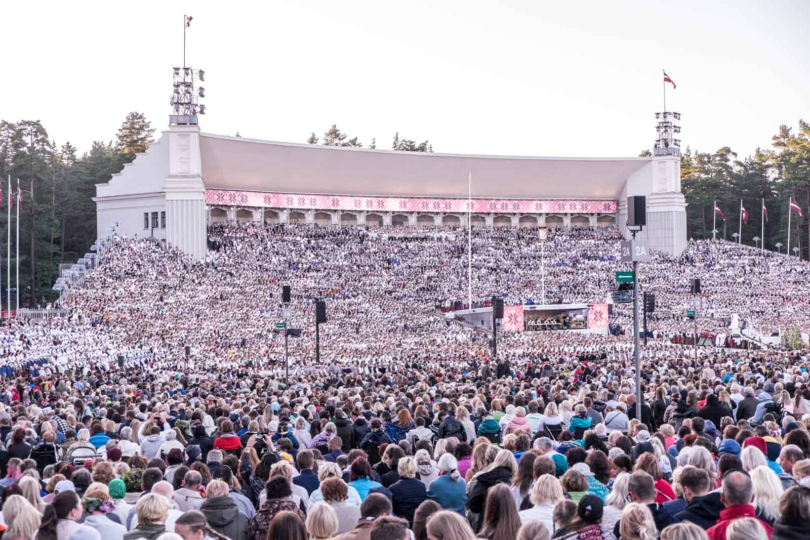 Thousands of choir singers perform in the closing show of the Latvia Song and Dance Celebration