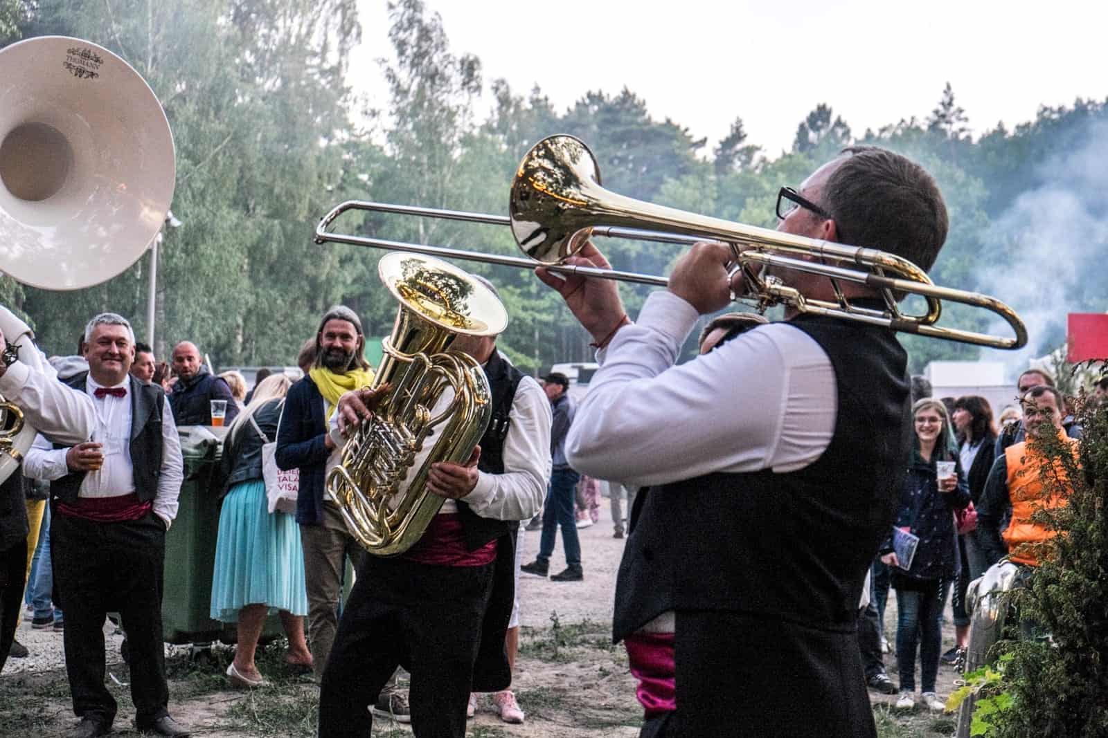 A band plays in the park during the closing show of the Latvia Song and Dance Celebration