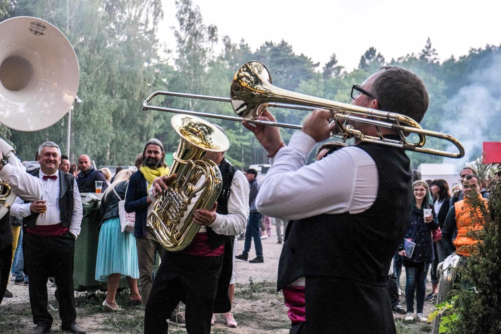 A band plays in the park during the closing show of the Latvia Song and Dance Celebration