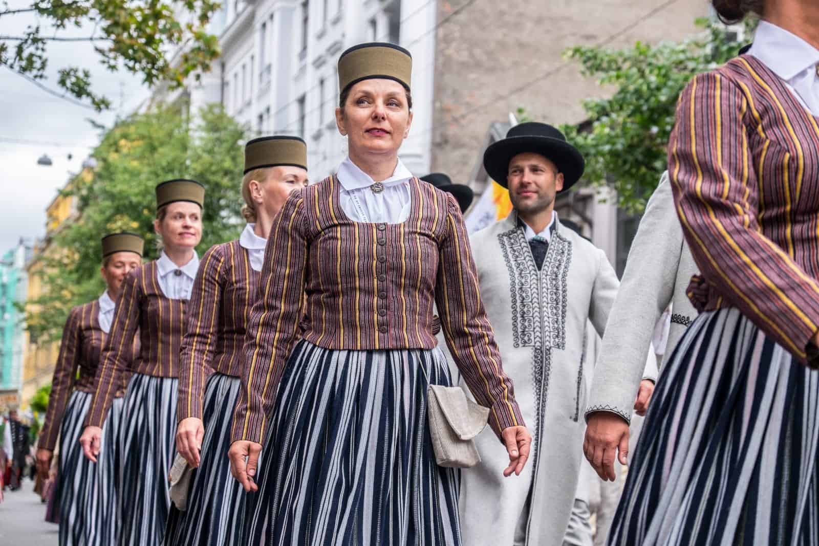 People performing in the Latvia Song and Dance Celebration street parade in Riga 