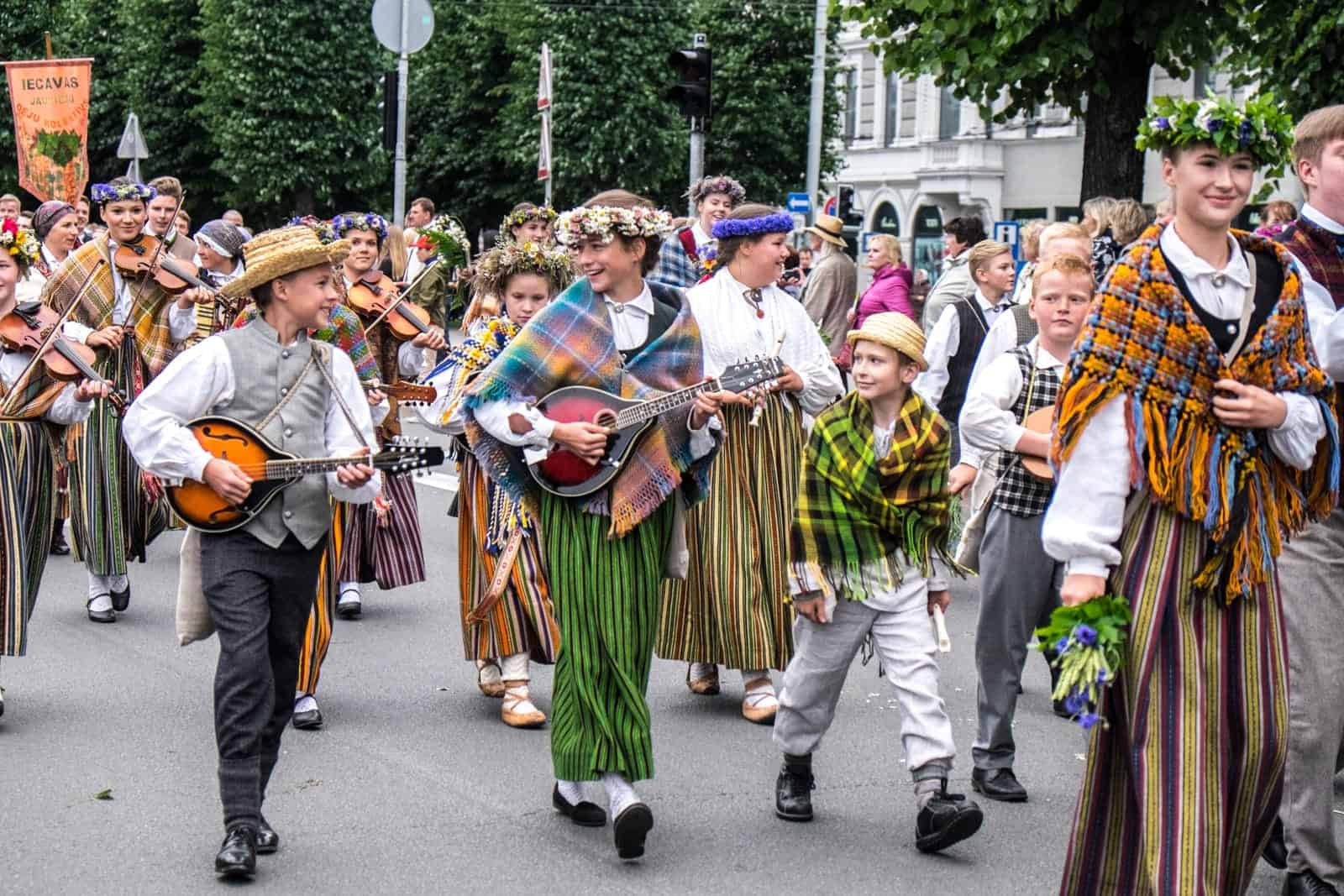 Children perform songs in the street at the Song and Dance Celebration in Latvia