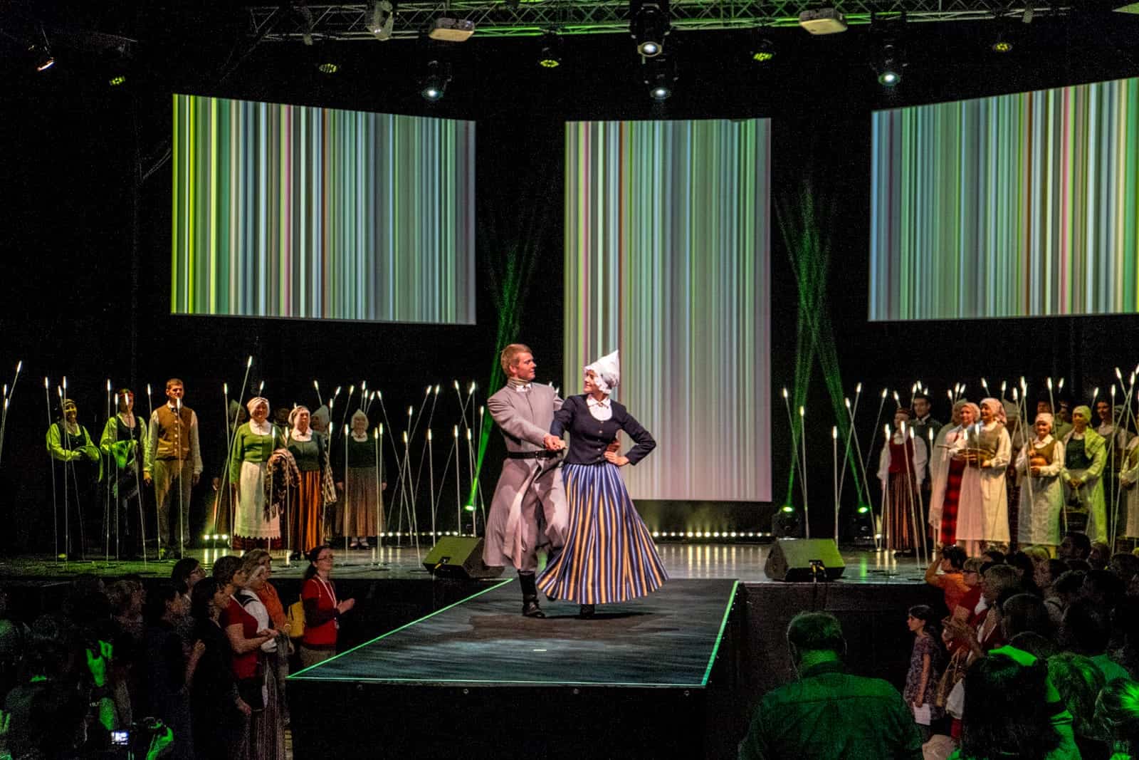 A couple dancing at the Folk costume catwalk show in Riga for the Song and Dance Celebration in Latvia