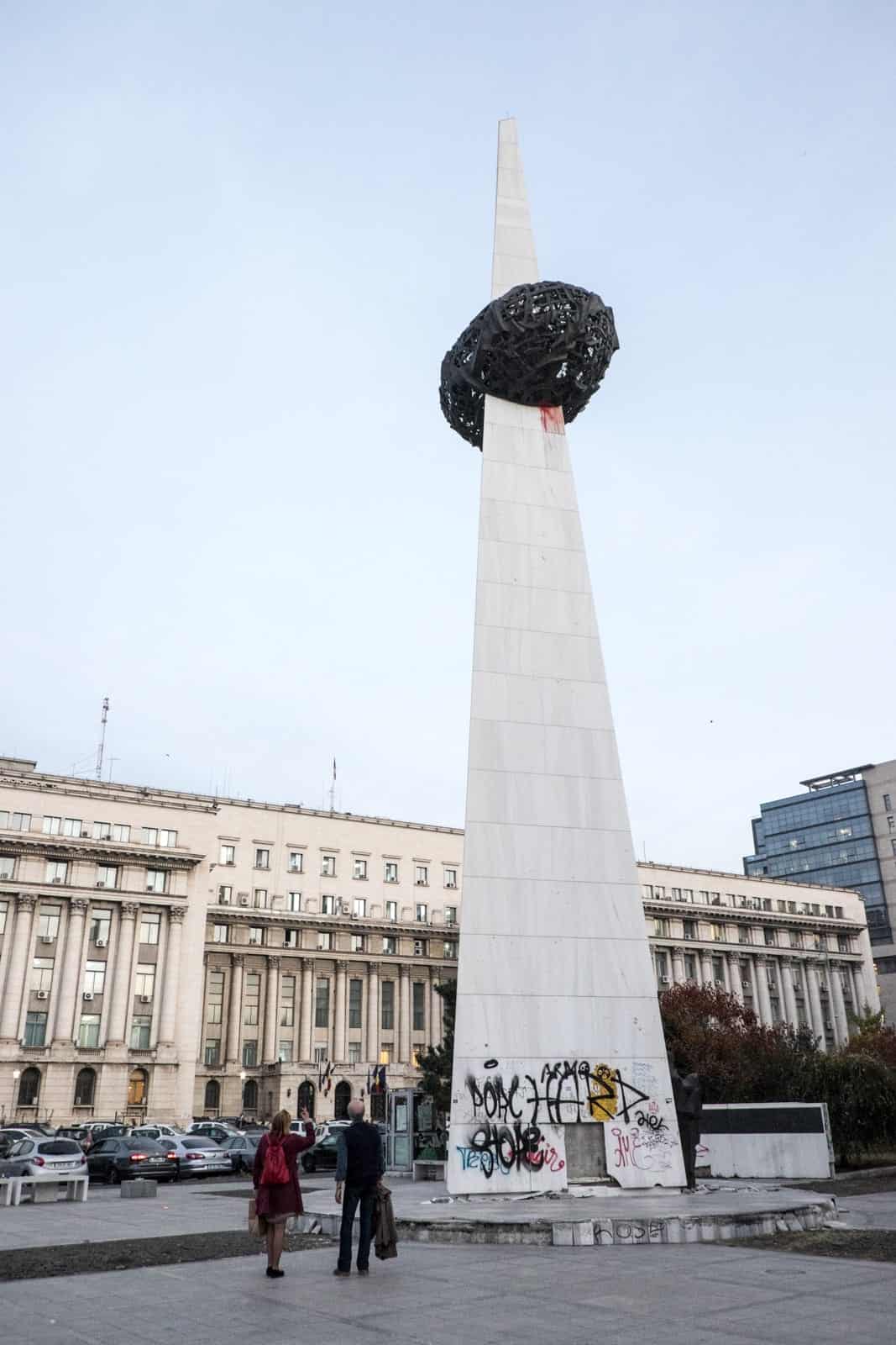 A white spiked memorial statue known as 'brain on stick' in Bucharest, Romania