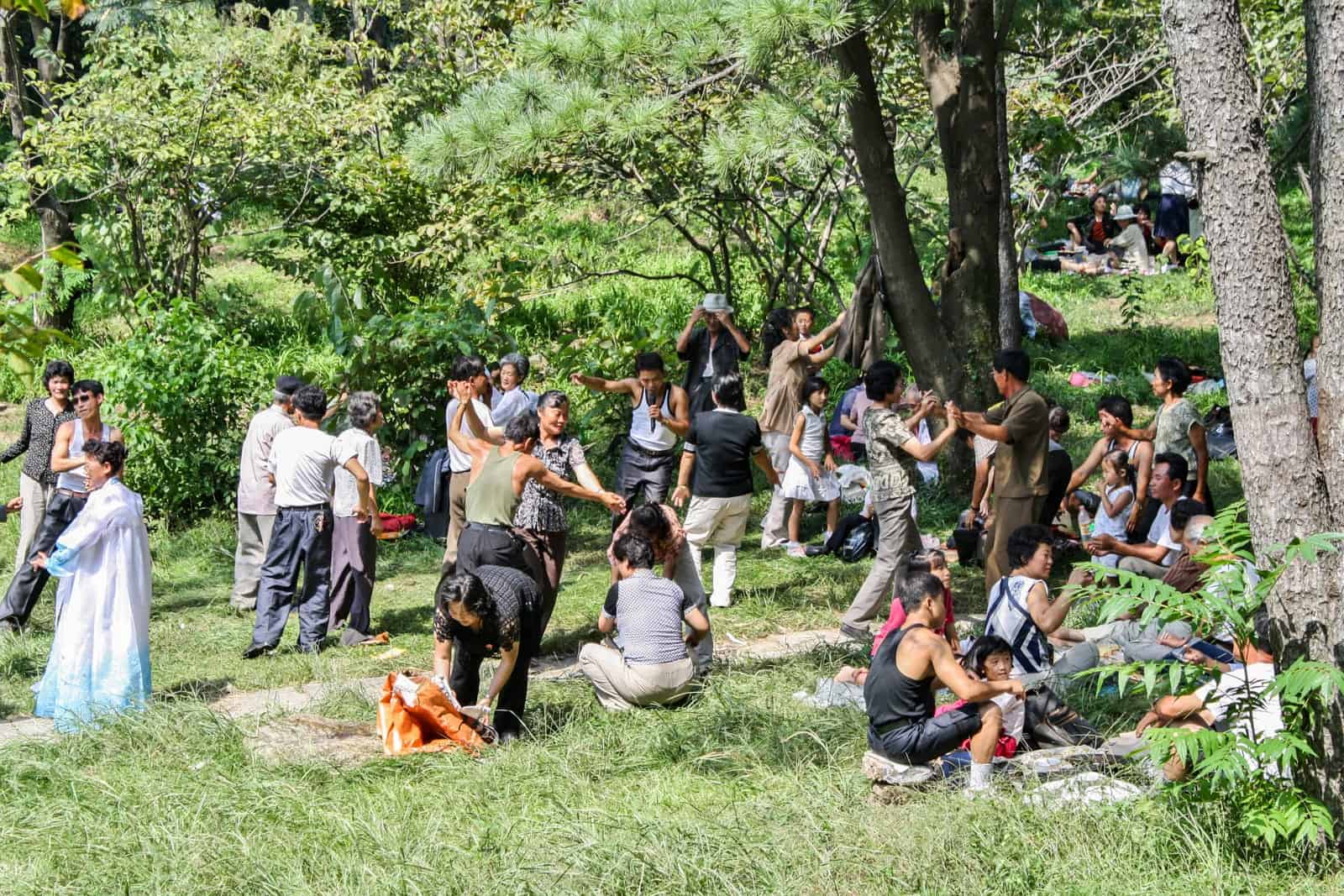 Locals dancing in the park on National Day in North Korea, as seen on a DPRK travel tour