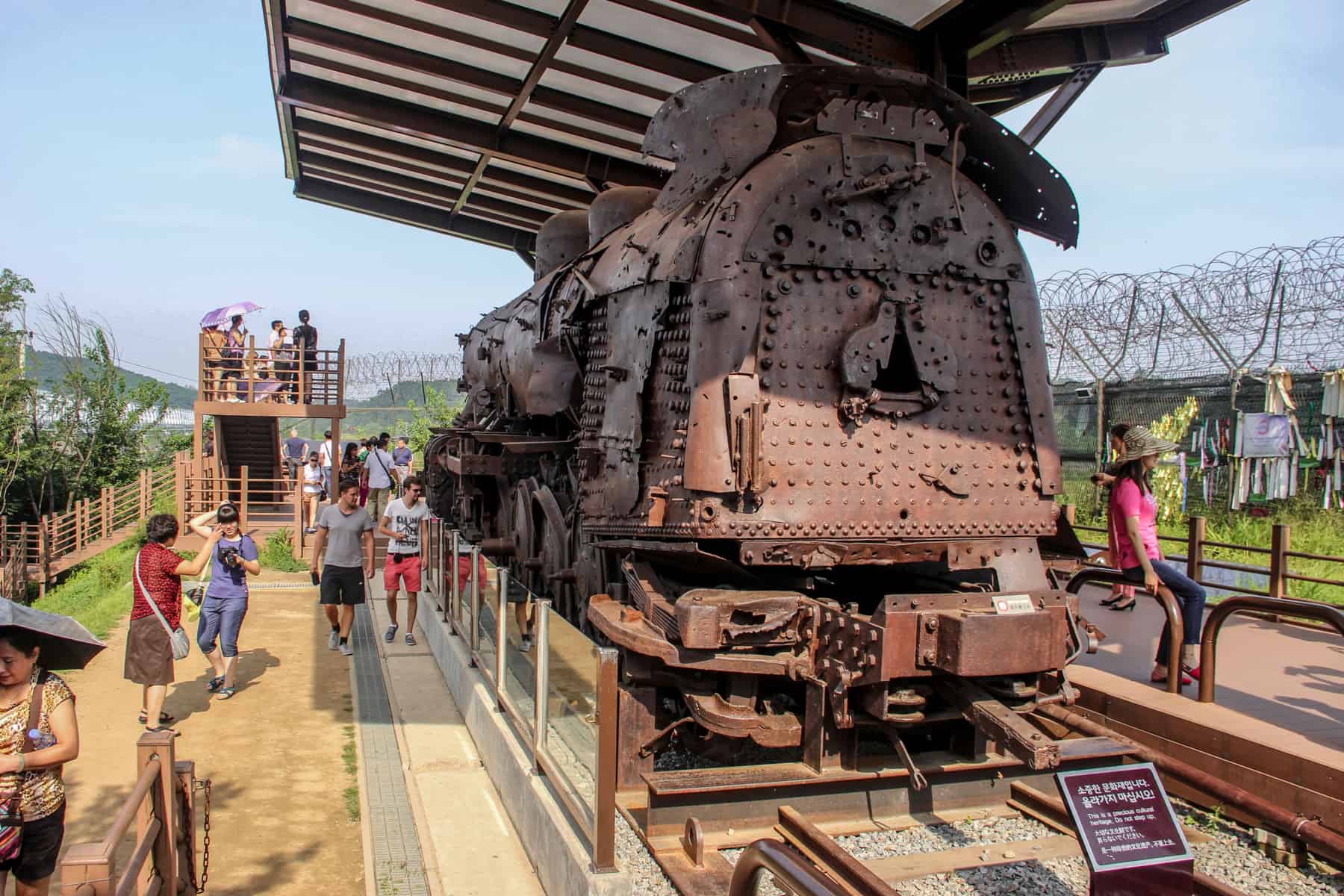 The metal relic of an old steam locomotive, derailed by bombs during the Korean War and displayed at the DMZ tour site in South Korea. 