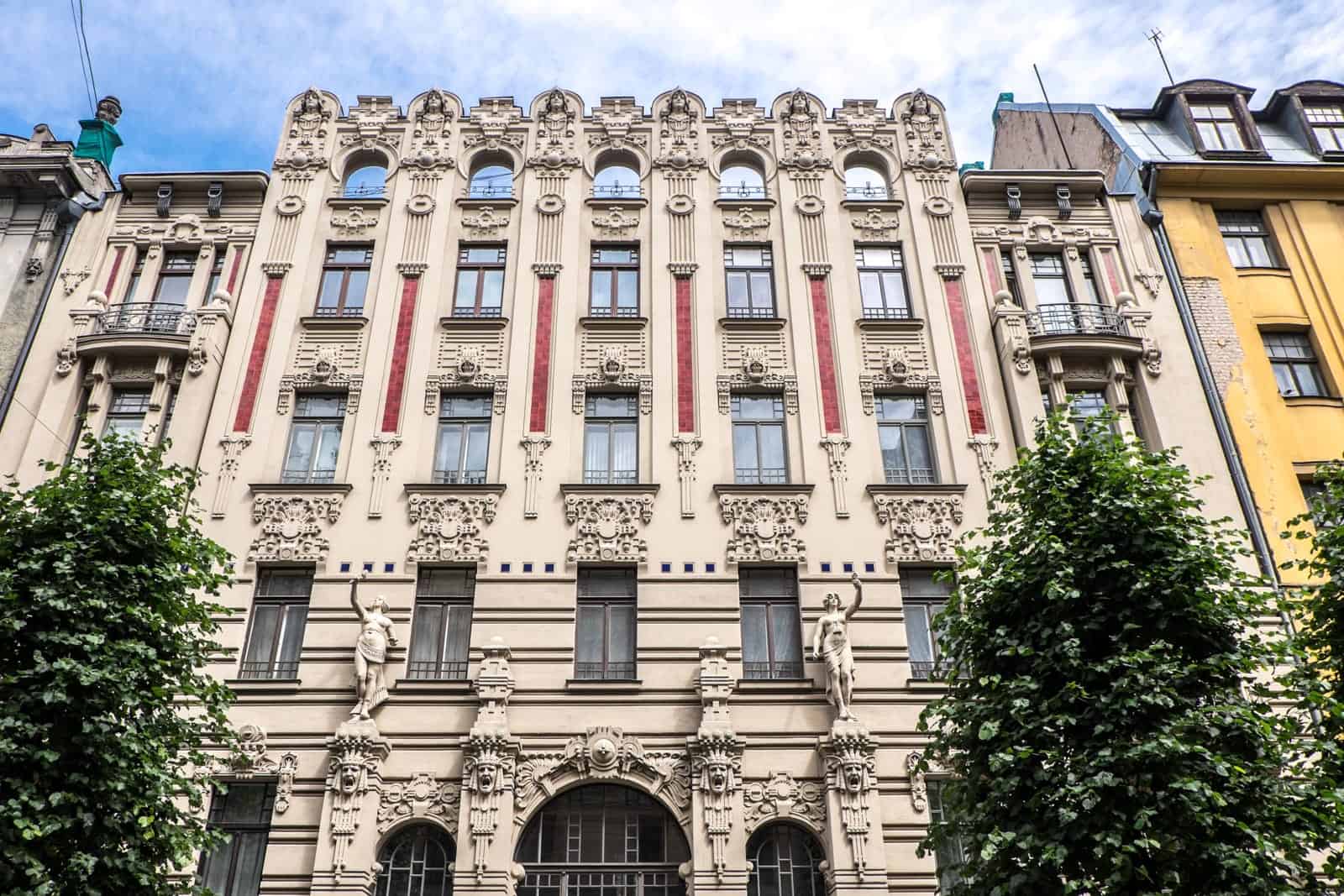 Flower and faces decor on Prominent Art Nouveau building in Riga, Latvia