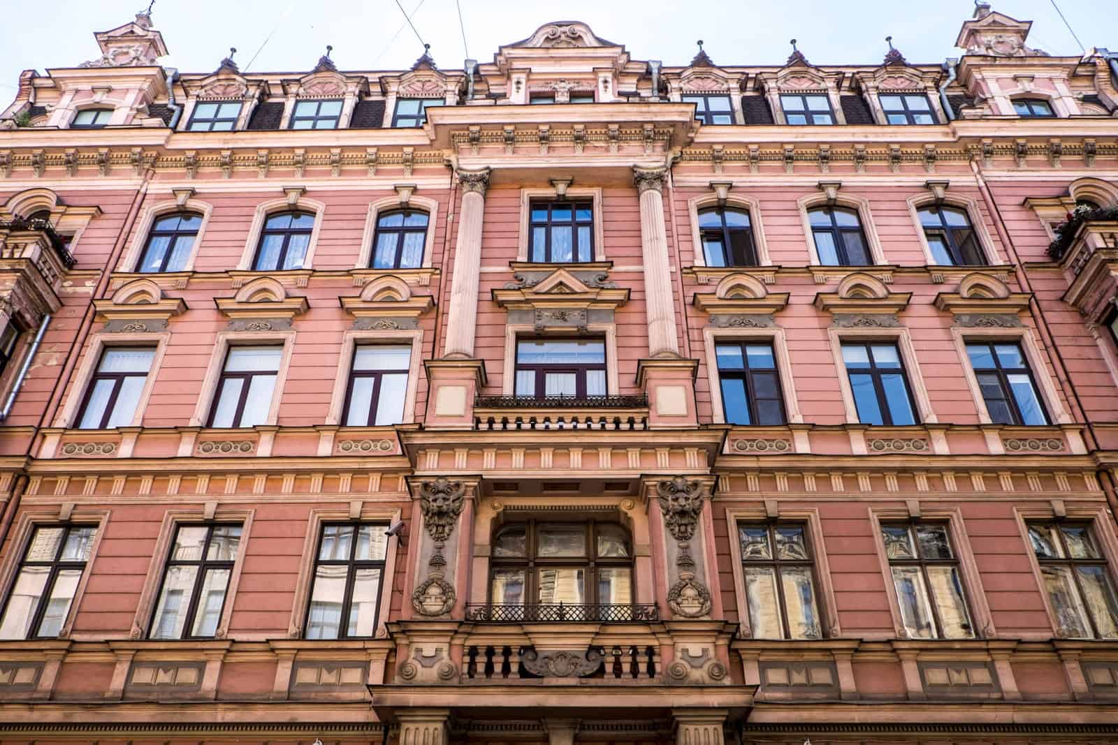 Orange and pink facade of Art Nouveau building in Riga, Latvia