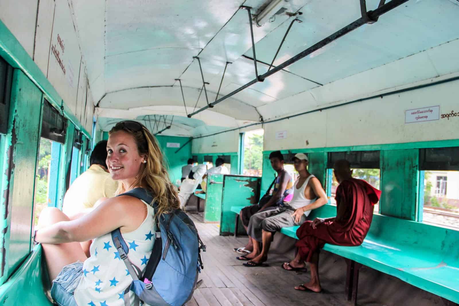 Tourist riding local train in Myanmar for budget travel