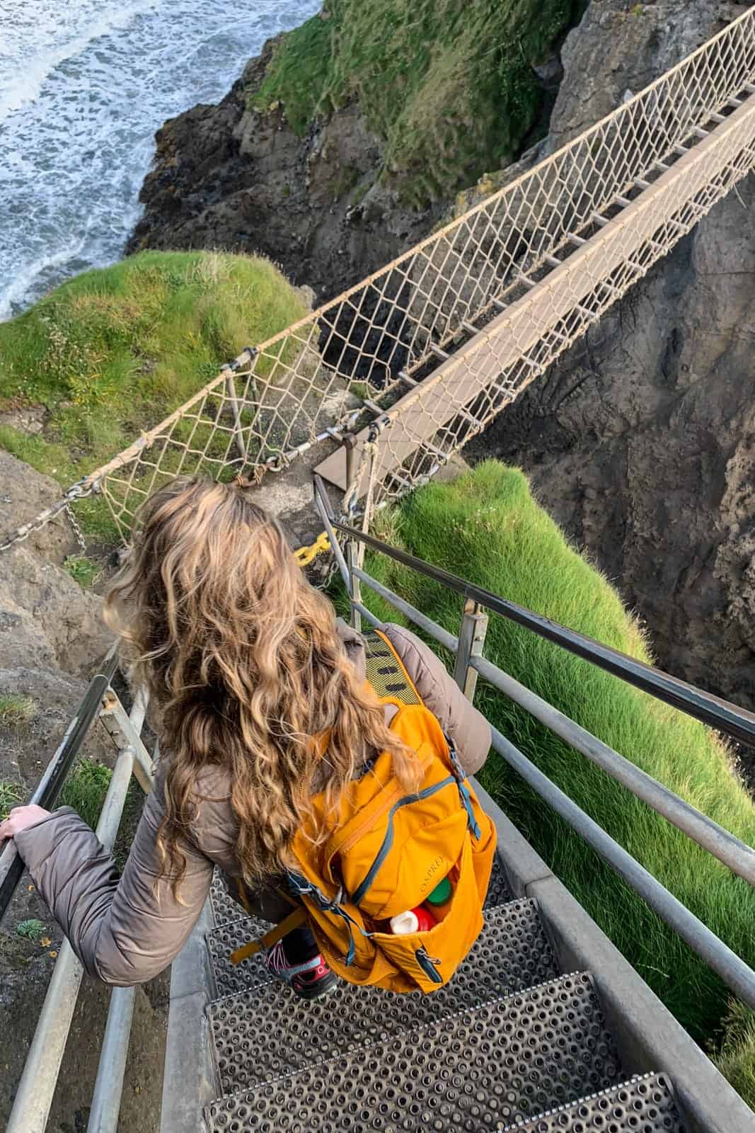 Crossing the Carrick-a-Rede Rope Bridge in Coastal Causeway Northern Ireland