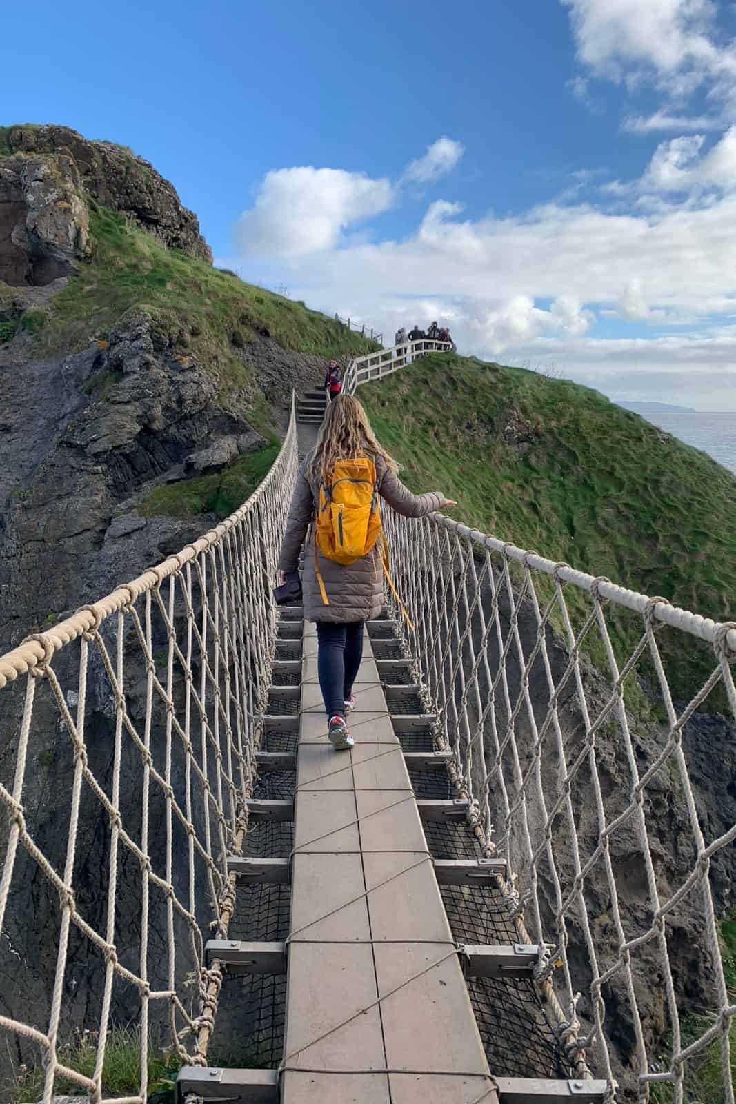 Crossing the Carrick-a-Rede Rope Bridge in Coastal Causeway Northern Ireland