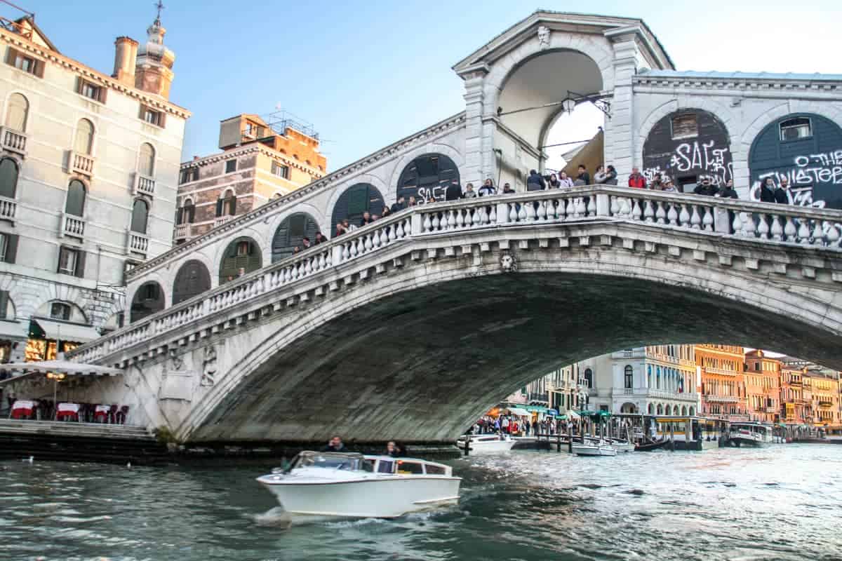 Venice bridge view from the water while riding a gondola