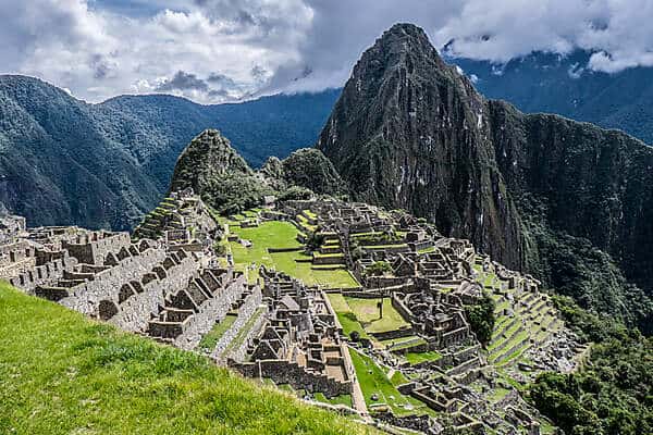 The stone Inca ruins of Machu Picchu upon a mountain in the Sacred Valley in Peru. 