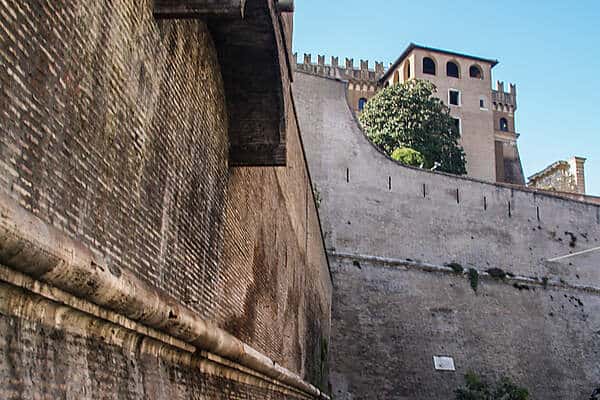 The looming stone walls of the Vatican City in Rome. 