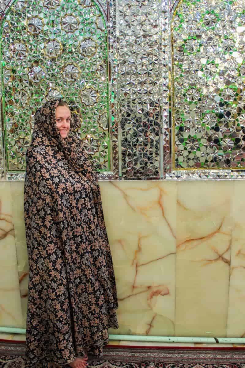 tourist wearing a chador in a mosque in Iran