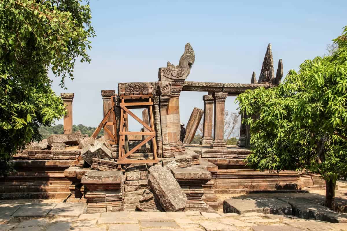 Crumbling, broken and fallen parts of Preah Vihear temple are stacked and held together by wooden beams