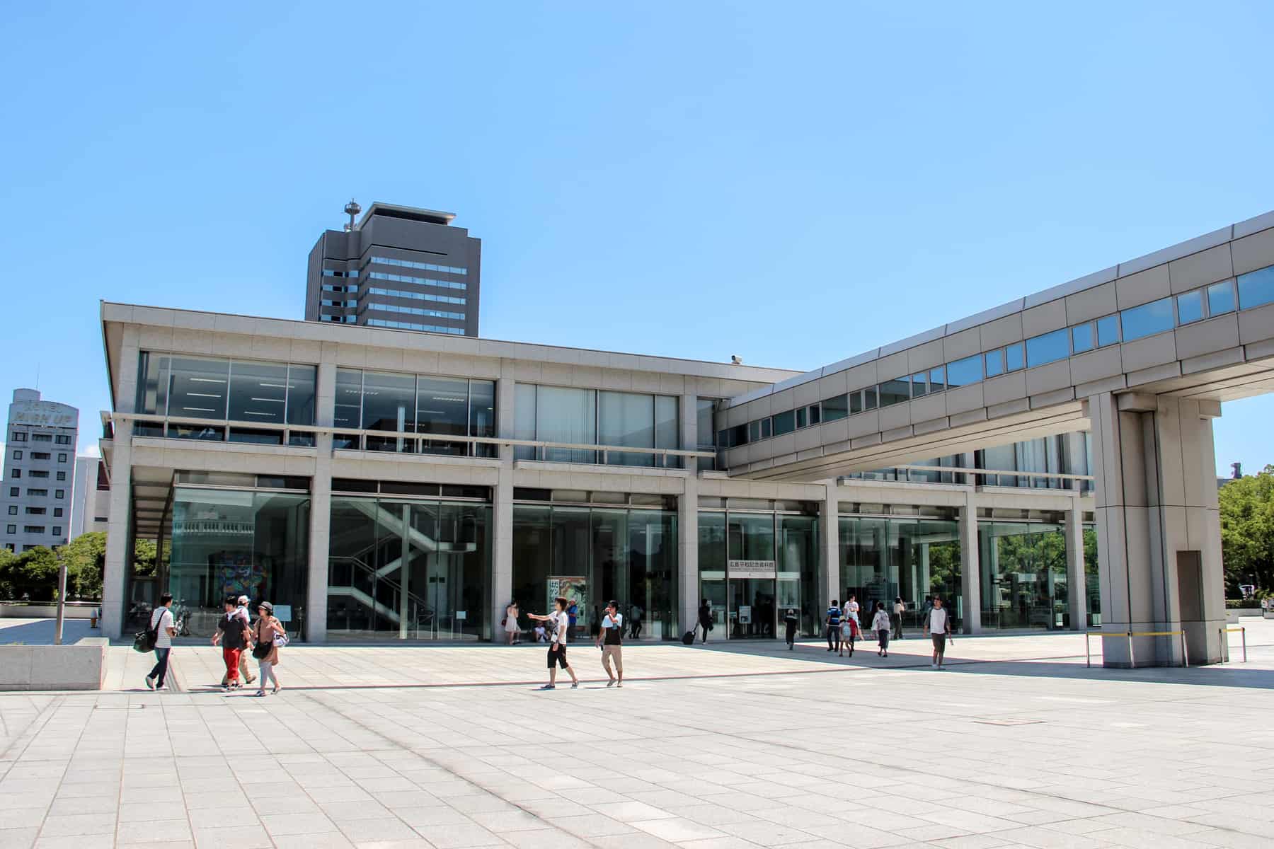 The stone and glass exterior of the Hiroshima Peace Memorial Museum.